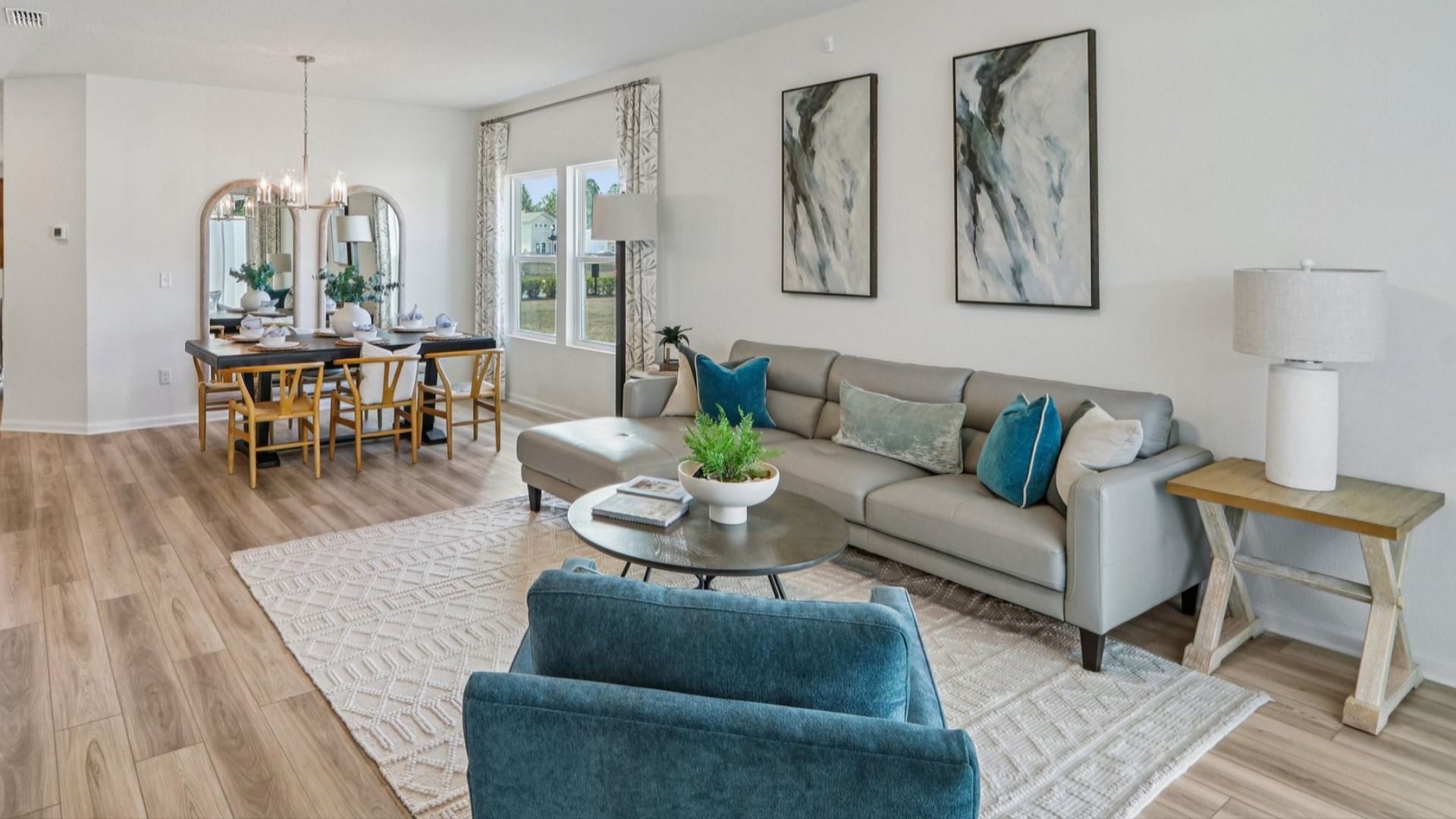 Discover refined elegance with sleek furnishings and abundant natural light in Panther Creek's luxurious living area.
