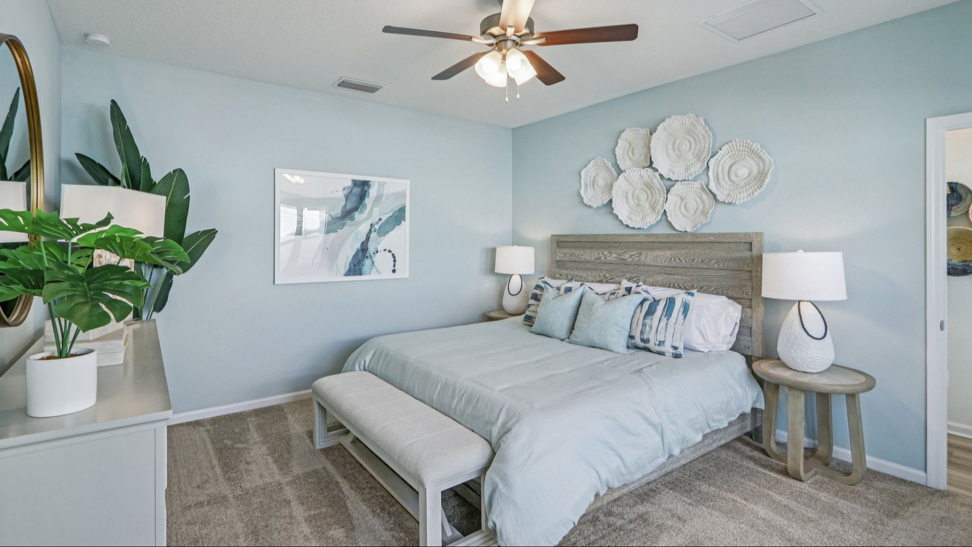Discover serenity in this Panther Creek bedroom with expansive windows and artistic textures.