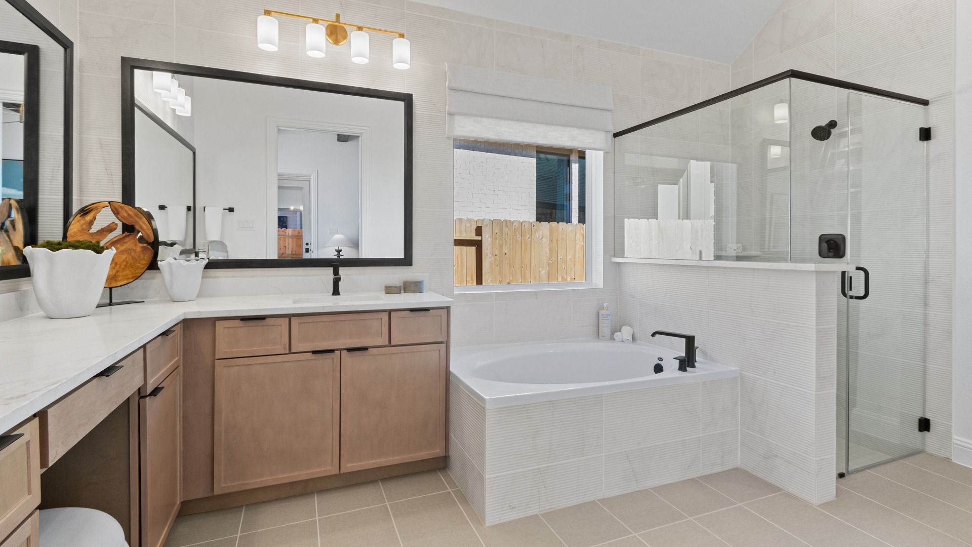 A spa-inspired primary bath featuring a separate soaking tub and walk-in shower for ultimate relaxation in Wildrye.