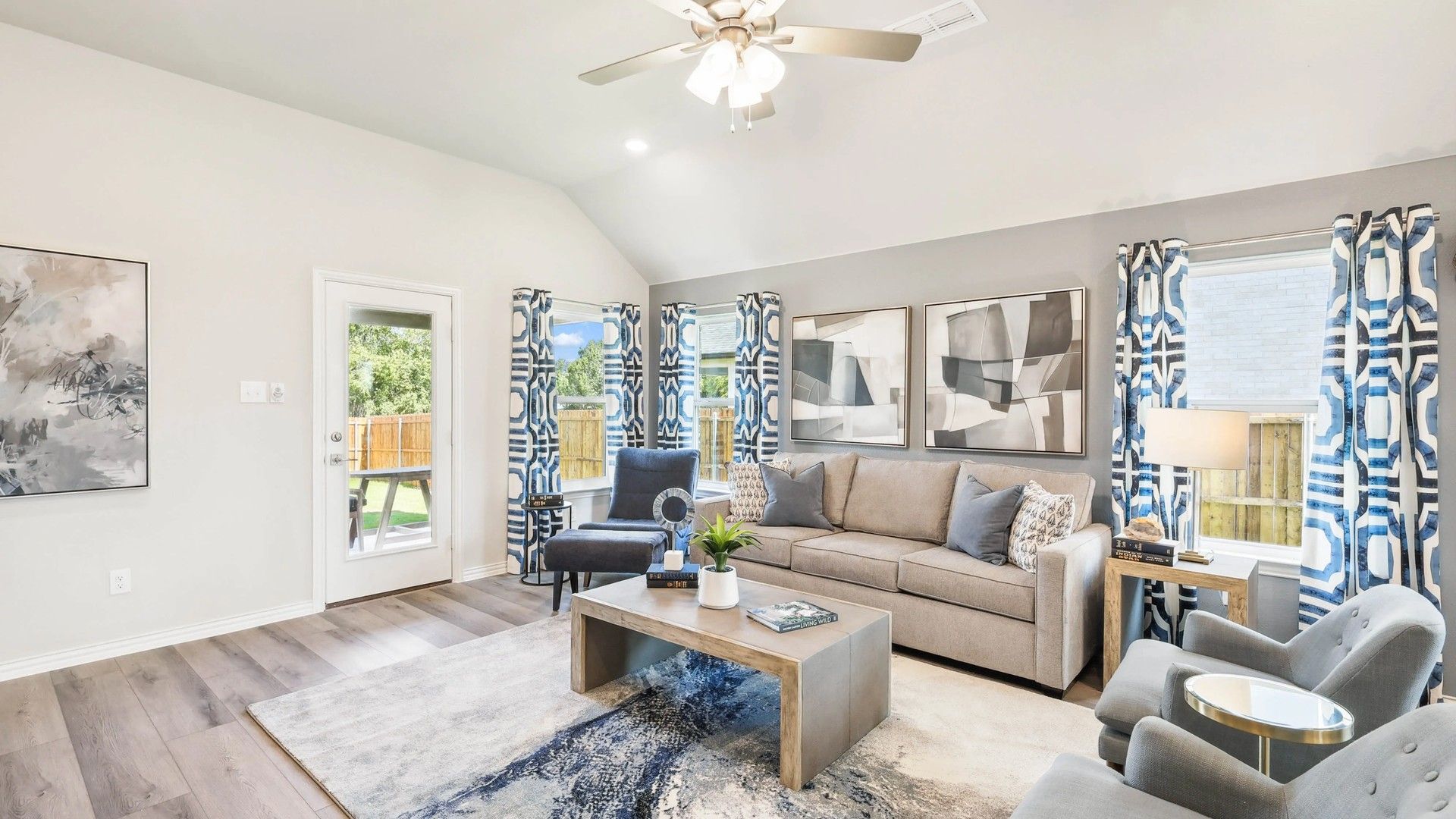 Enjoy refined elegance in this Pebblebrook living room, featuring geometric decor and expansive windows.