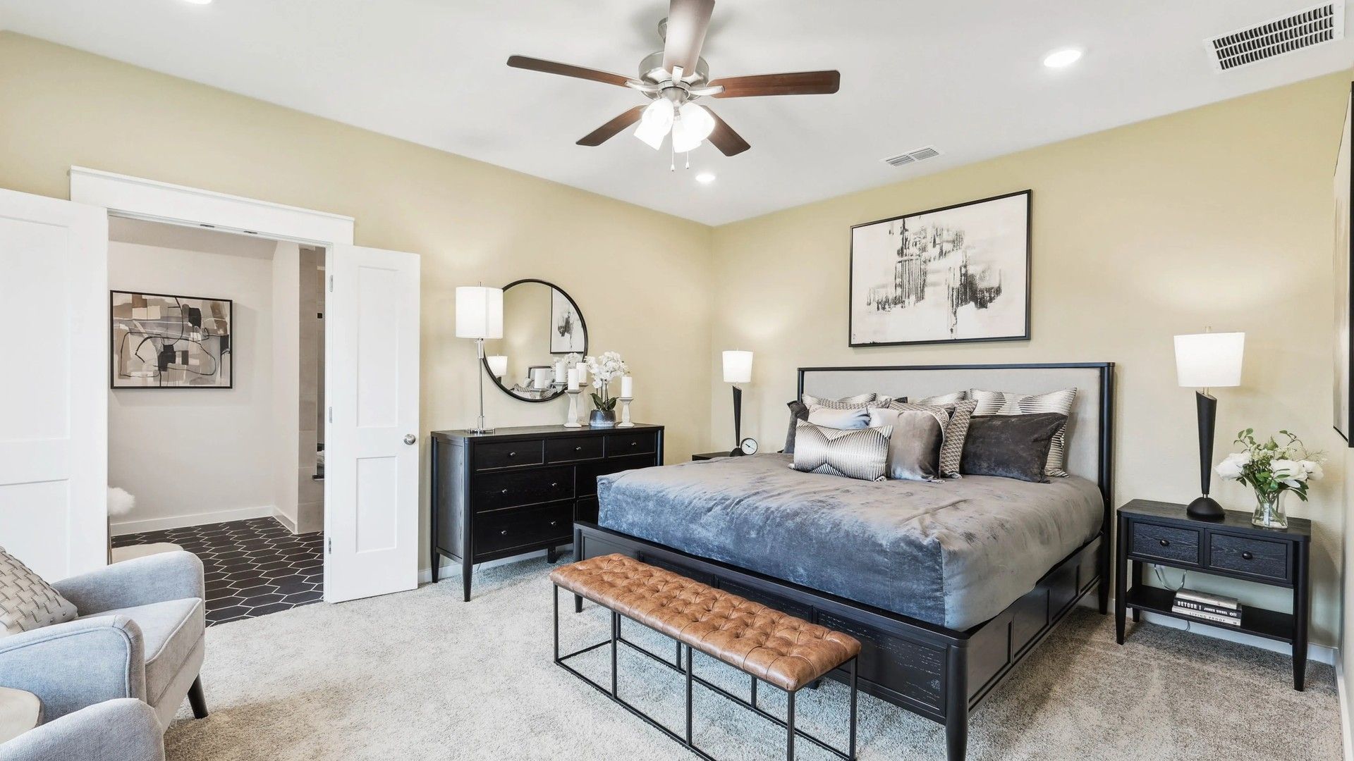 Indulge in sophisticated design with dark wood furniture and plush textures in Simpson Crossing's opulent retreat.