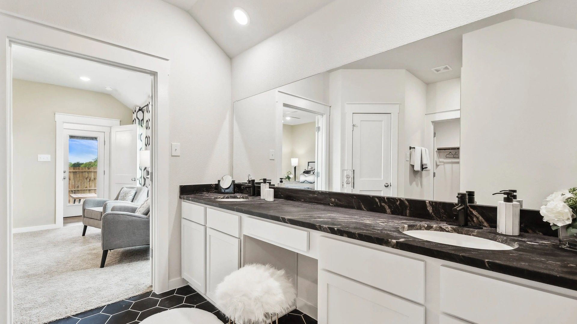 Indulge in elegance with a black marble countertop and sleek hexagonal tiles at Simpson Crossing.