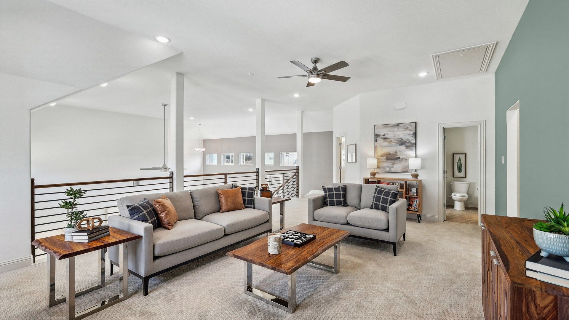 Luxurious Solterra lounge showcases plush seating, sleek metal railing, and exquisite wood tables.