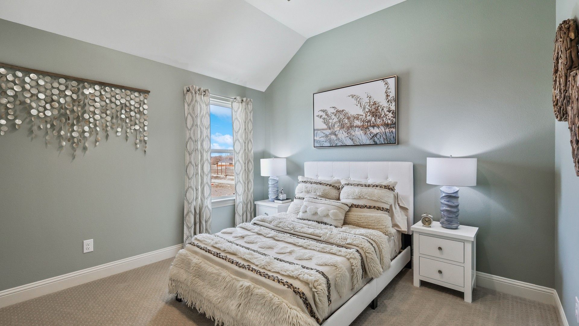 Experience luxury with vaulted ceilings, plush textures, and tasteful decor in Solterra, Texas.
