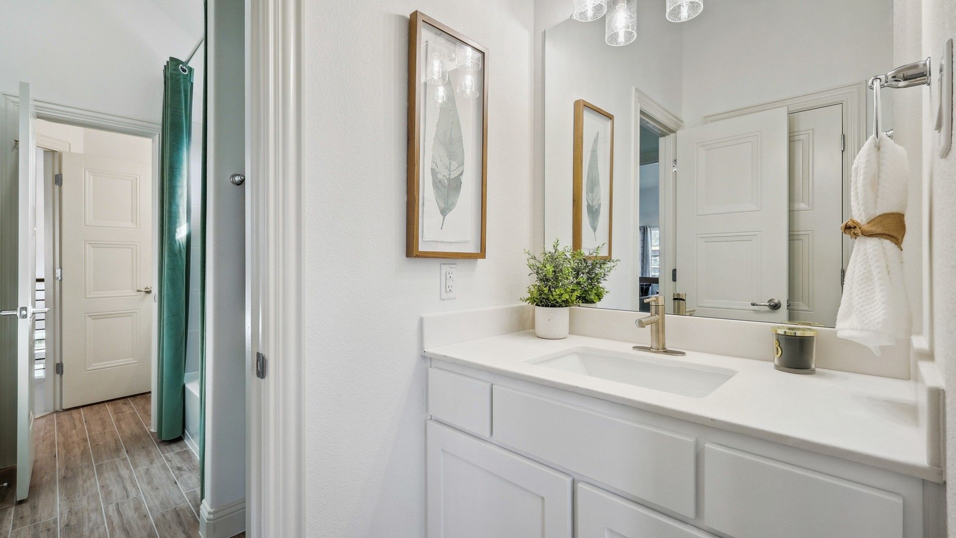 Quartz countertop and refined cabinetry elevate this Solterra Texas bathroom to unparalleled elegance.