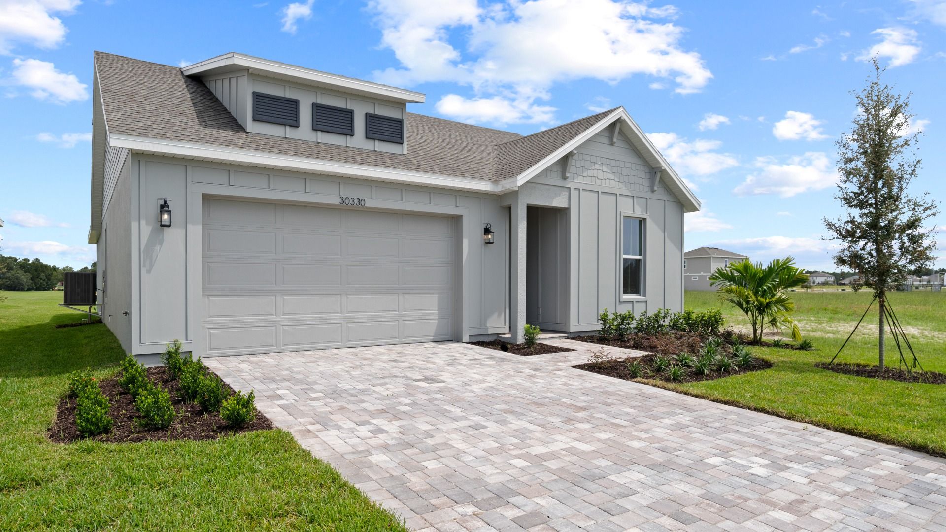 New Home in Longleaf Floor plan in Farmhouse Elevation Front Exterior by DRB Homes in Lakeside at Satilla