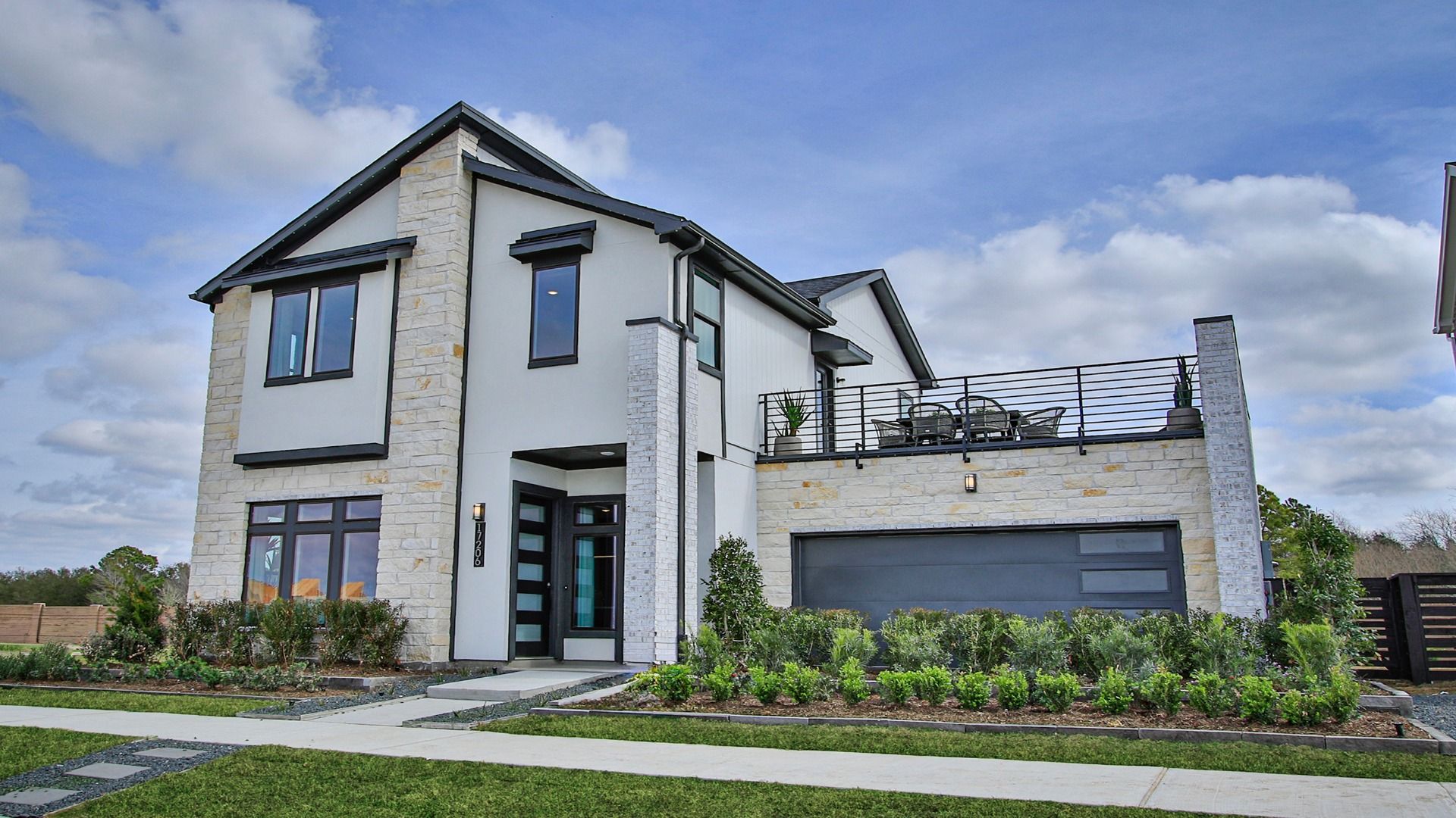 This contemporary home in Bridgeland Central showcases a rooftop-top style outdoor deck.