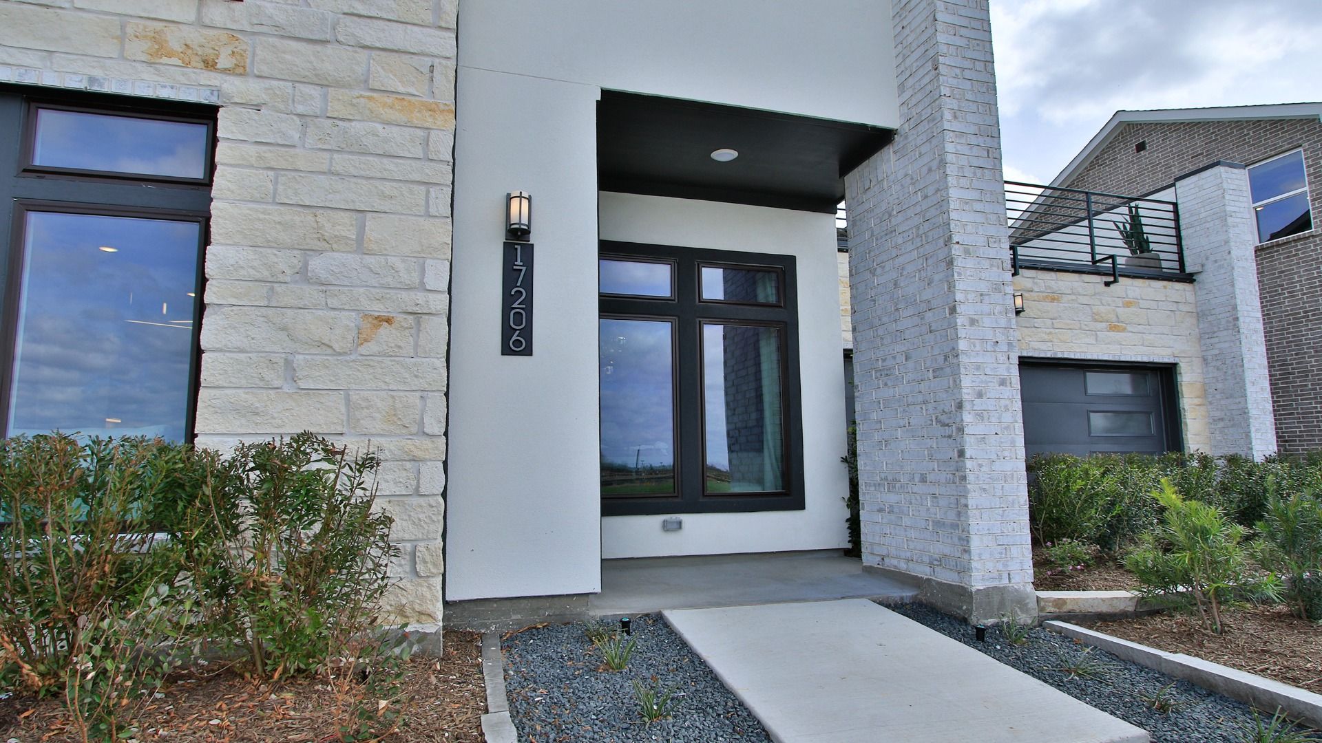 Front entrance designed for a warm first impression of this Bridgeland Central home.
