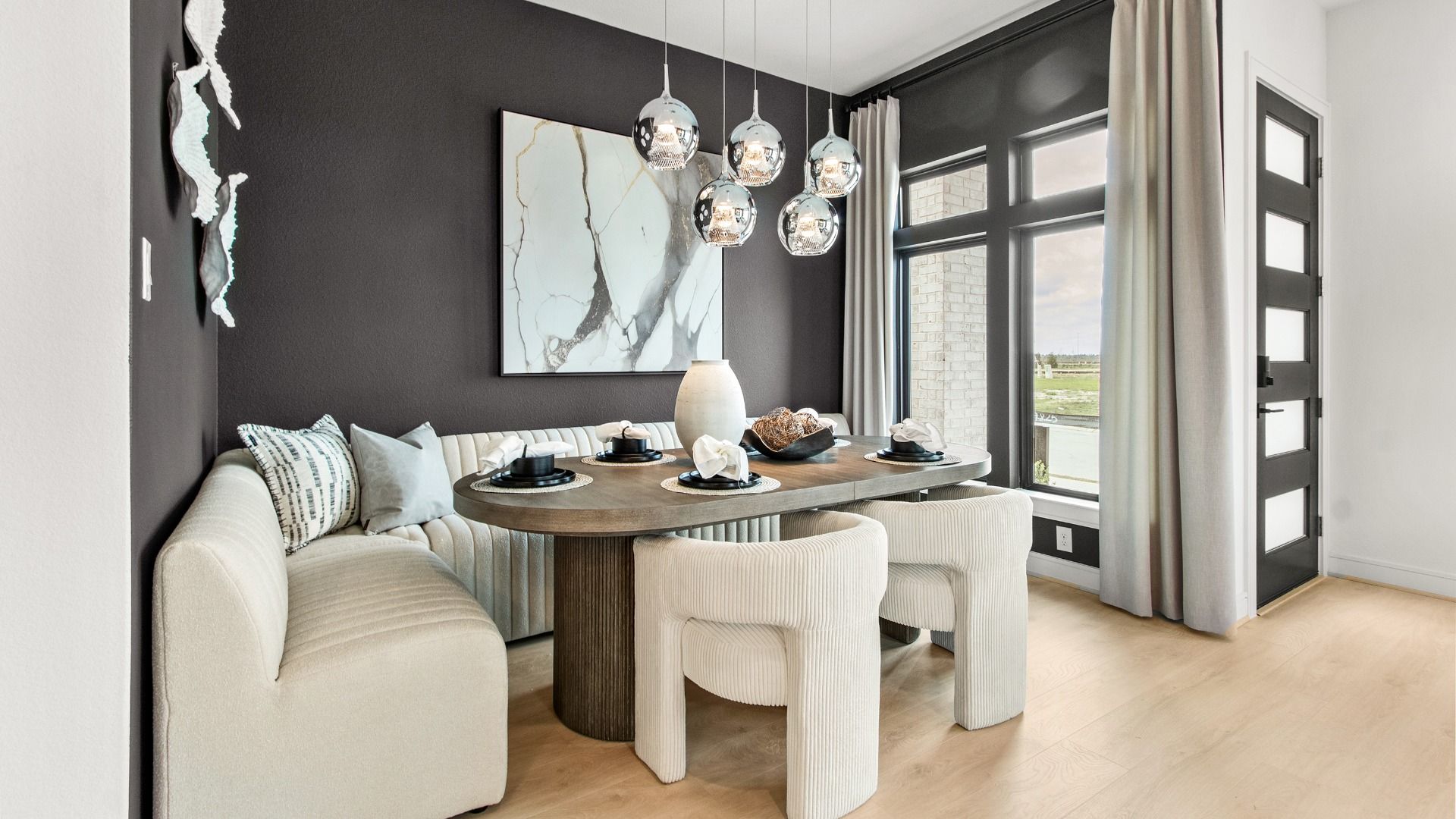 Natural light pours into this dining space in Bridgeland Central through large windows.