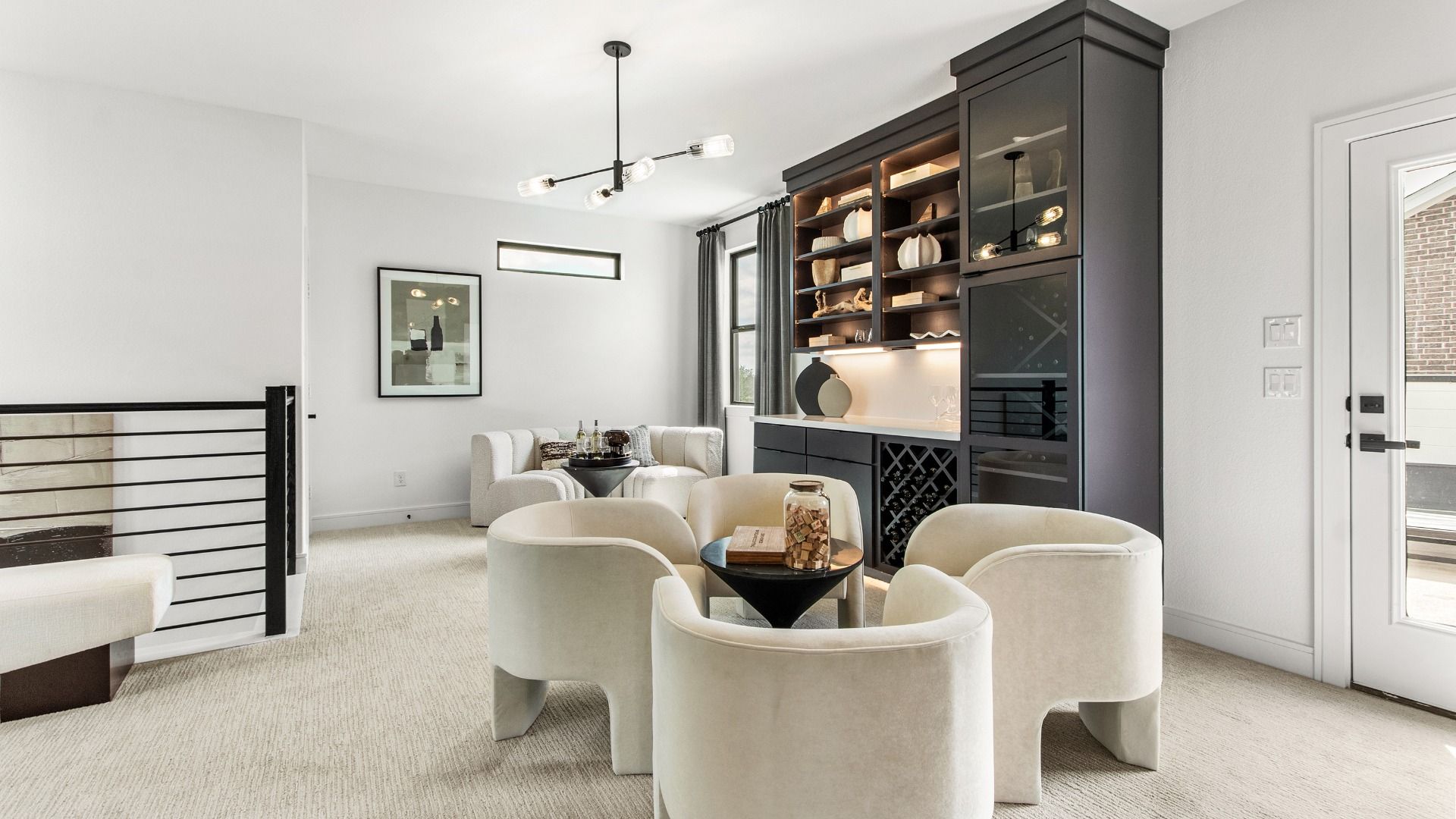 Stylish entertainment space in Bridgeland Central with black cabinetry and modern fixtures.