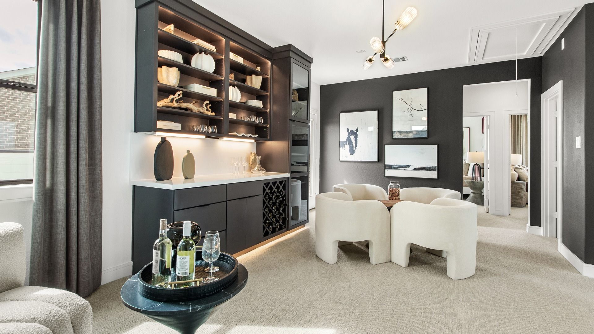 This game room in Bridgeland Central features custom cabinetry and modern lighting.