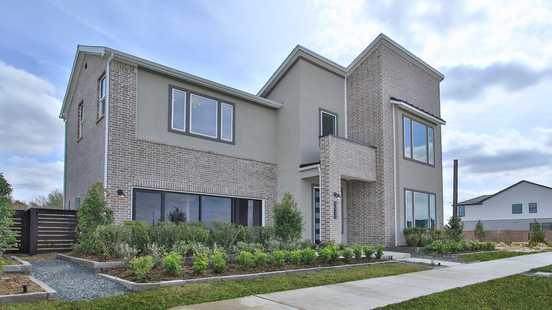 Stylish mixed-material exterior in Bridgeland Central creates a modern curb appeal.