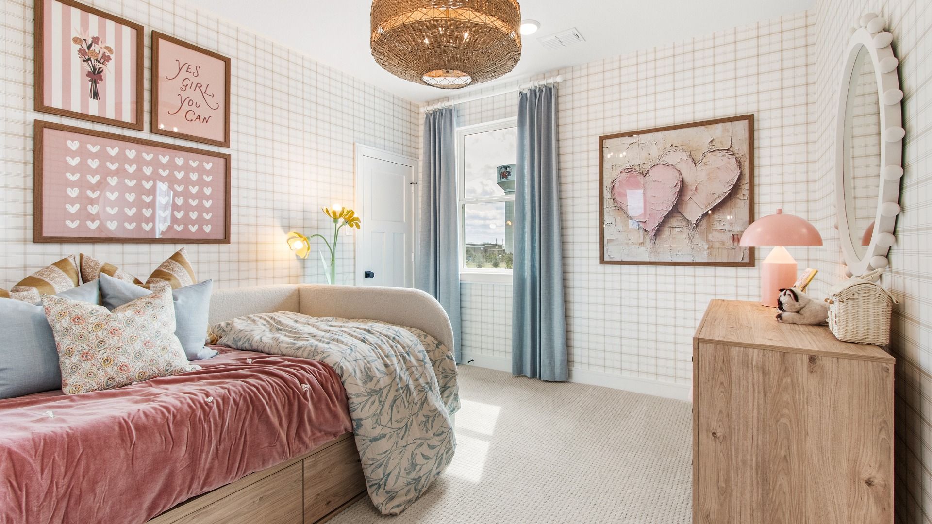 Decorative wall patterns create a unique secondary bedroom in this Bridgeland Central home.