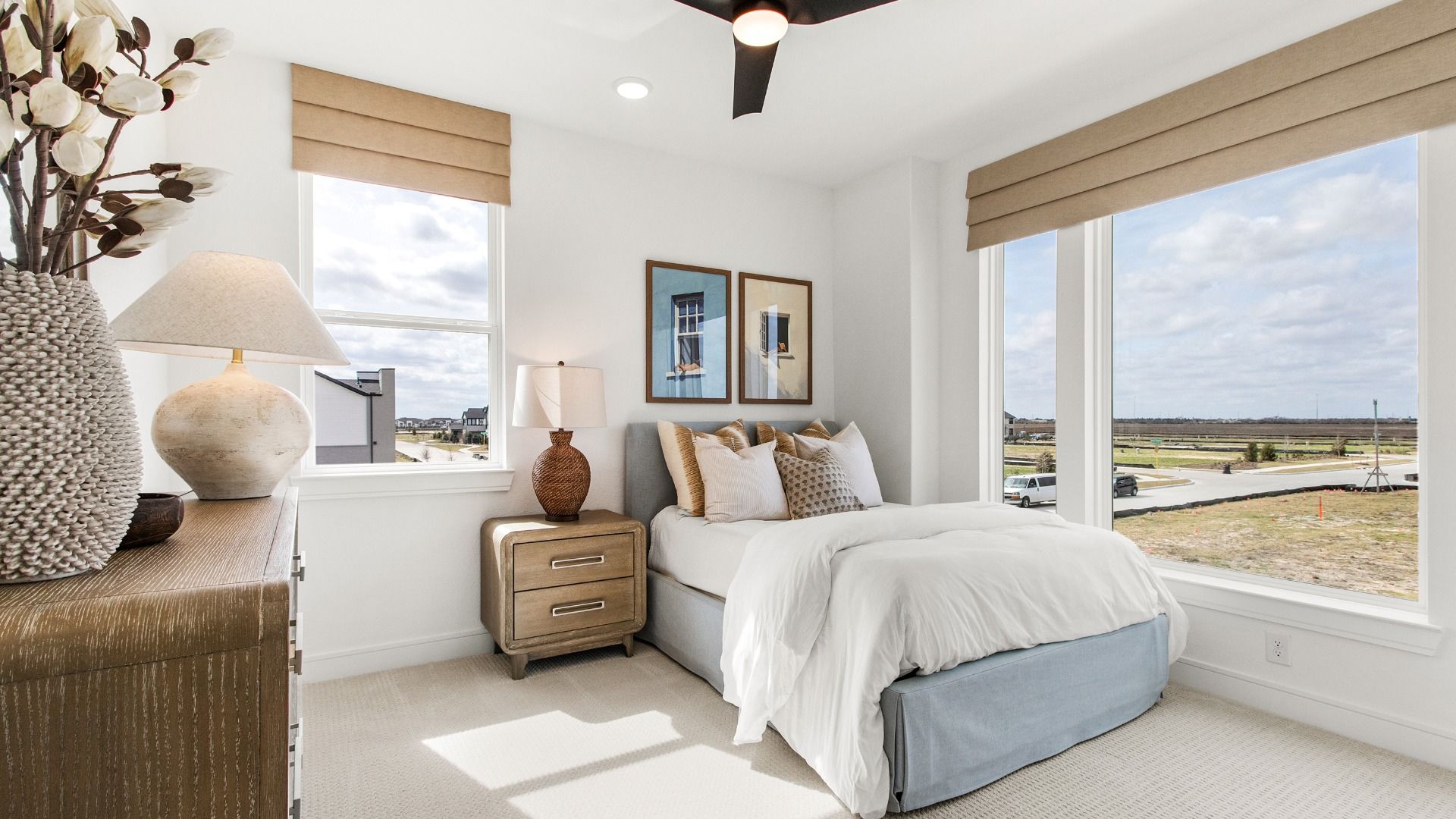 This bedroom in Bridgeland Central feels open and calm with large windows.