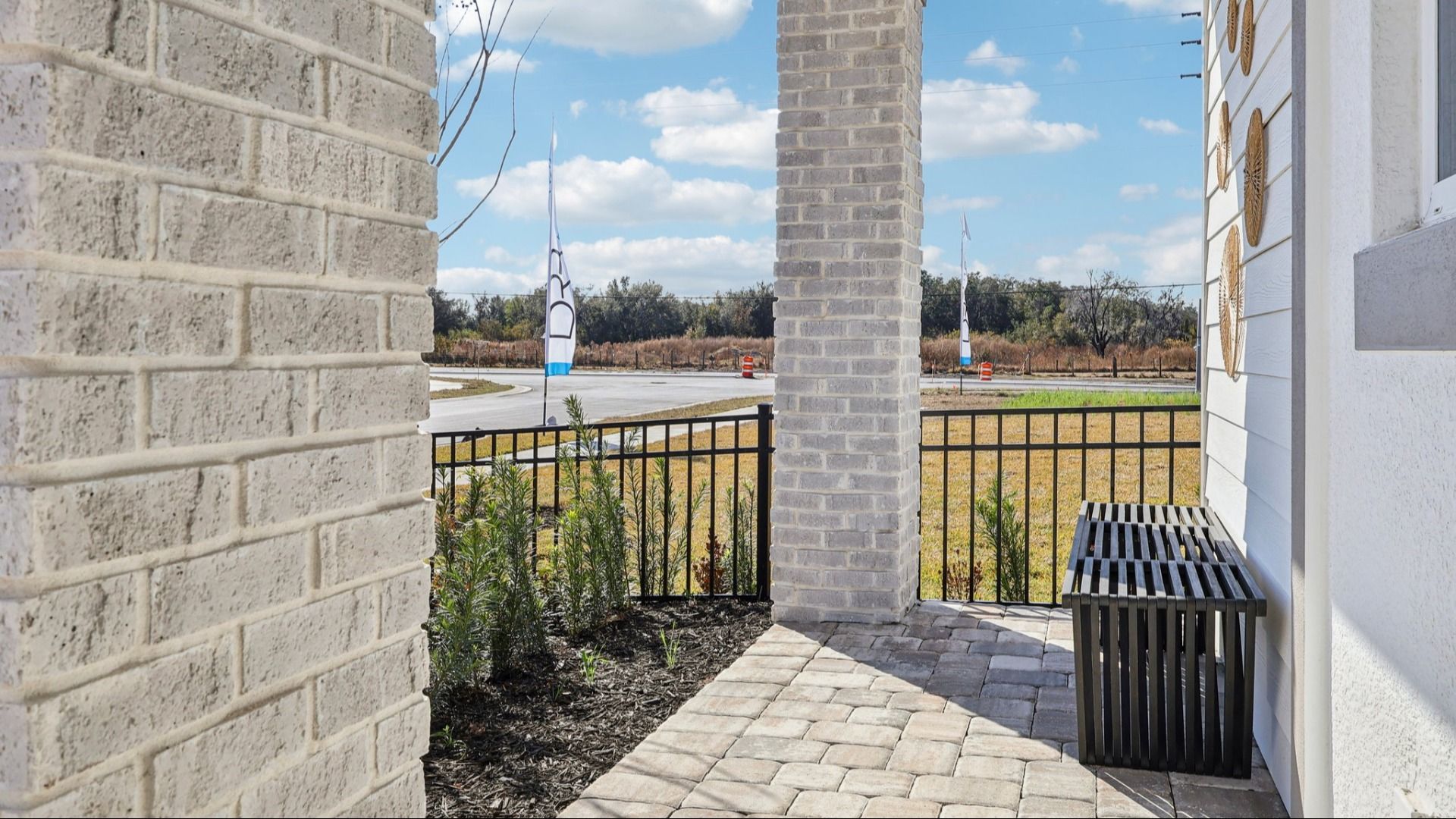 The Mangrove Model Front Porch in a Modern Elevation at Lakeside at Satilla by DRB Homes in Saint Cloud, FL