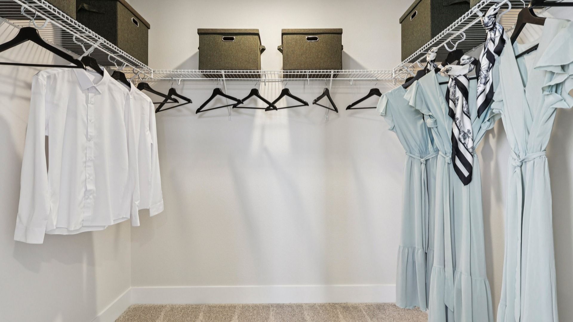 The Mangrove Model Primary Suite Walk-In Closet at Lakeside at Satilla by DRB Homes in Saint Cloud, FL