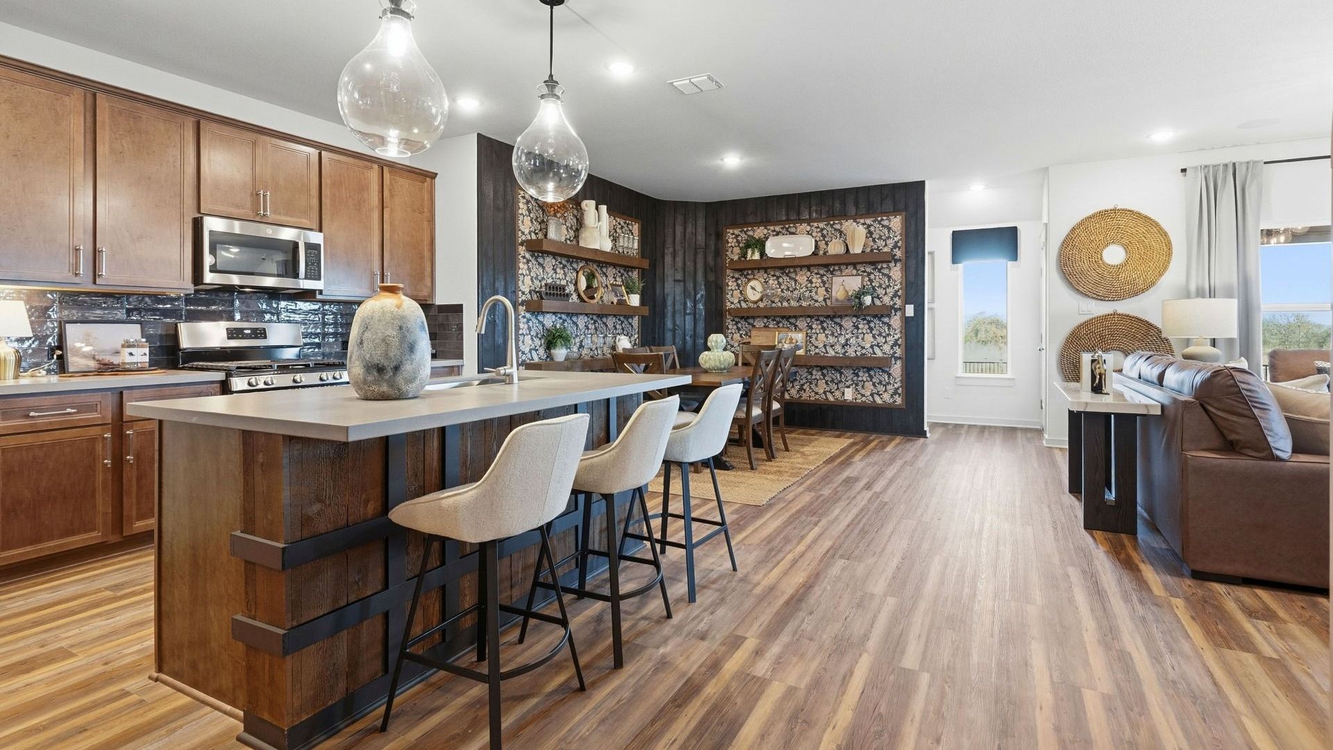 Experience elegance with this Infinity Square home featuring exquisite brickwork and a gabled roof.