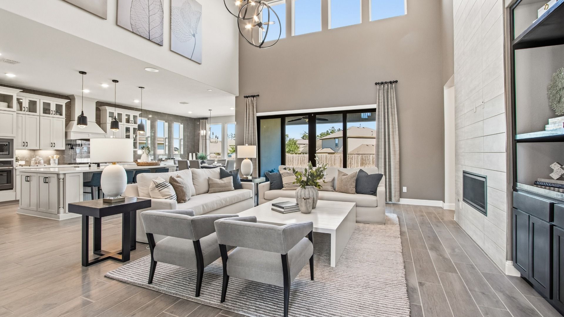 Experience luxury with high ceilings, sleek fireplace, and elegant decor in Mostyn Manor Reserve.