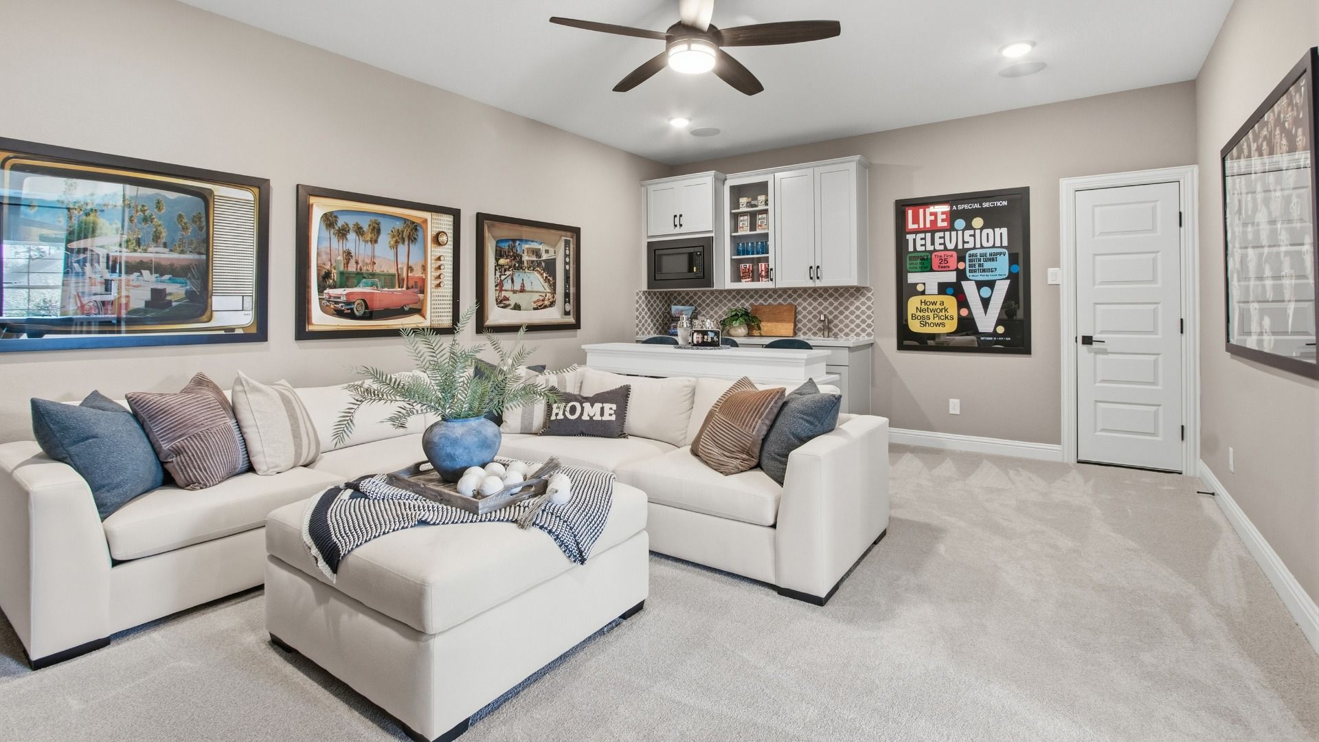 Elegant living space in Mostyn Manor Reserve featuring custom cabinetry and chic design.