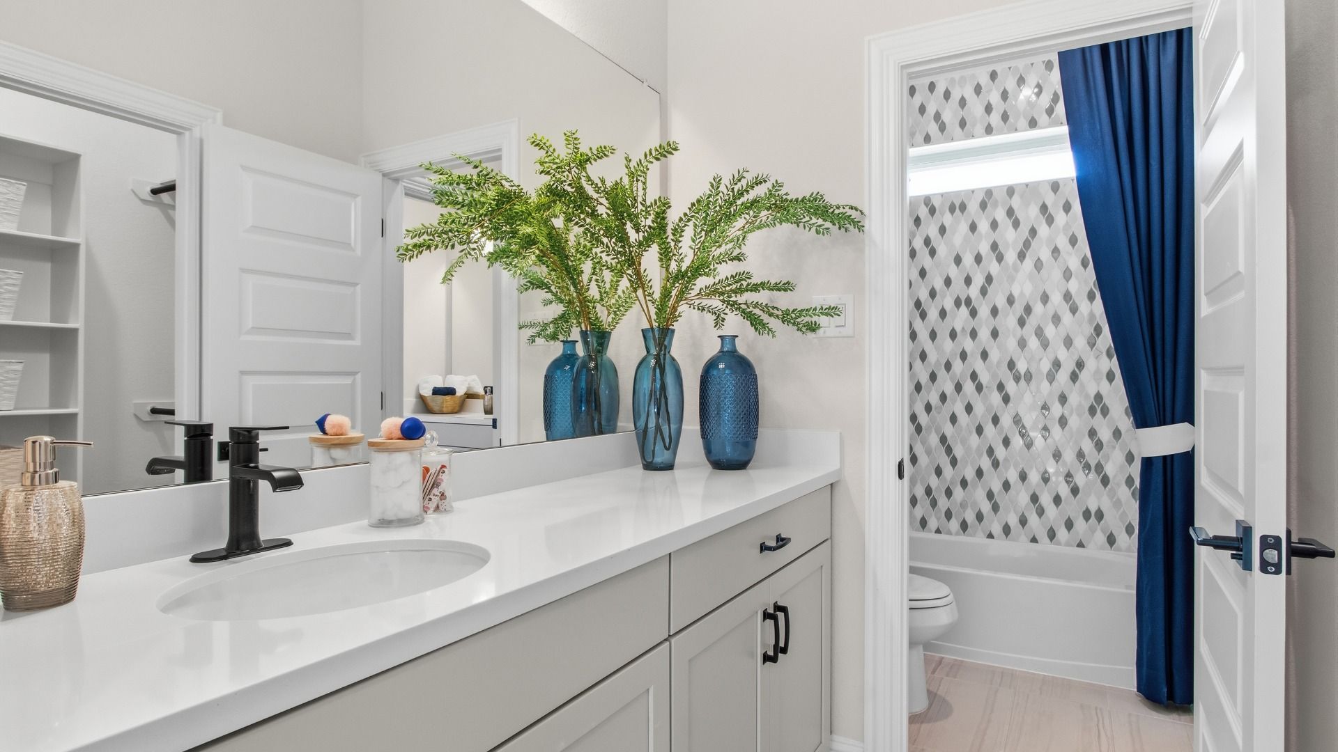 Guest bathroom with ample cabinet space