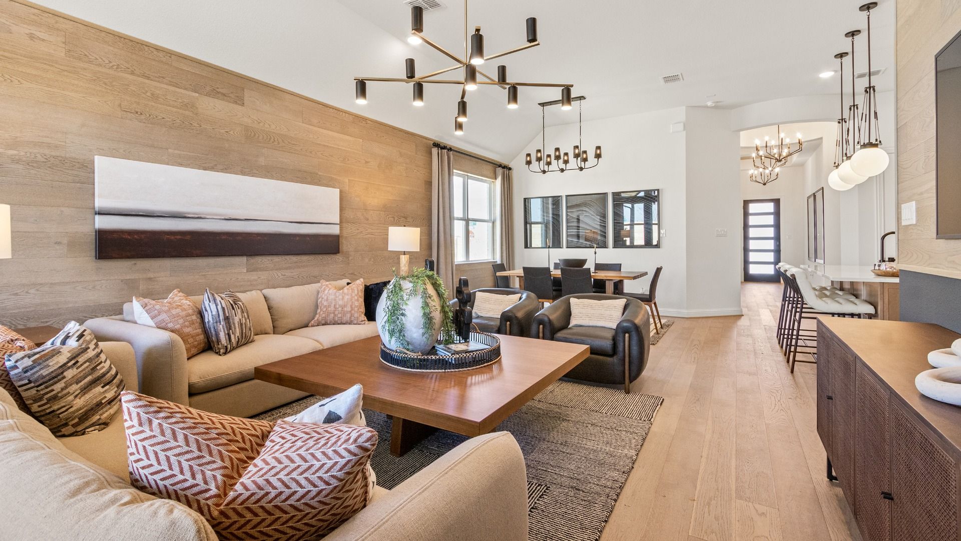 Experience sophistication with wood paneling, designer lighting, and an airy open plan in River Ranch.