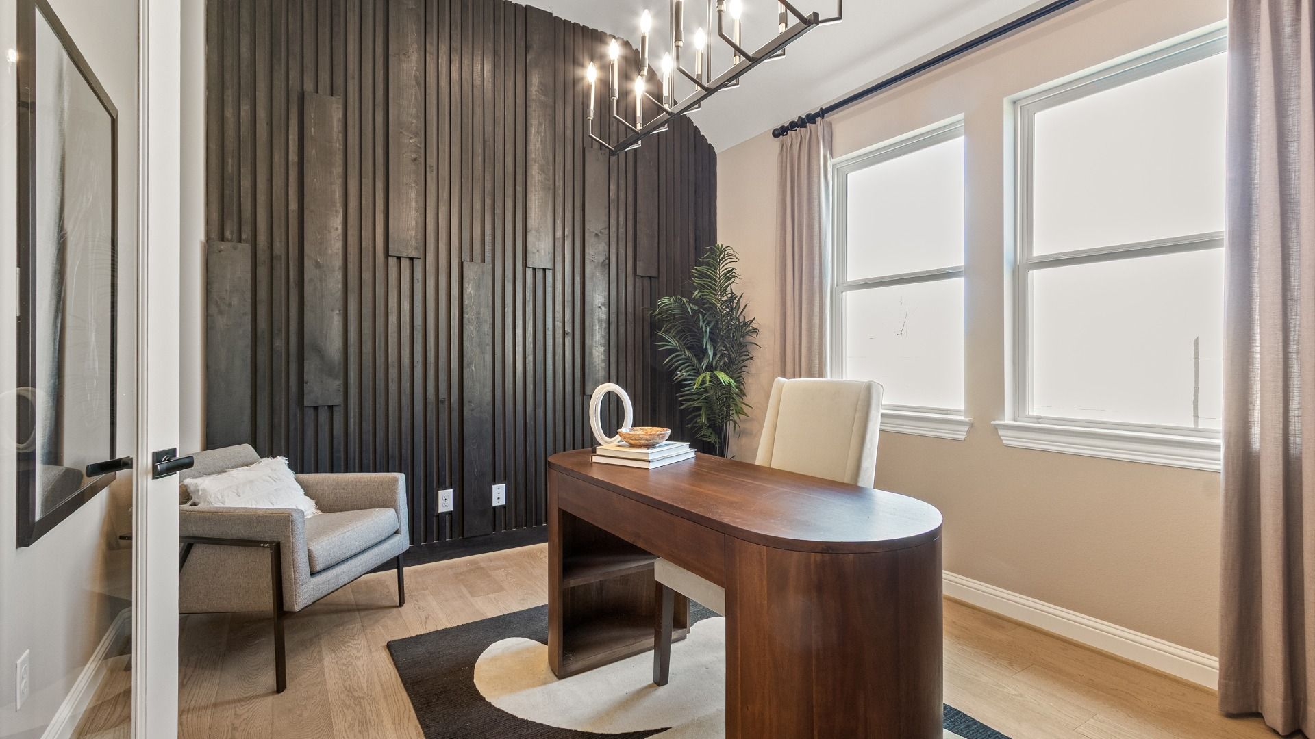 Luxurious River Ranch office with designer lighting, bespoke wooden elements, and elegant furniture.