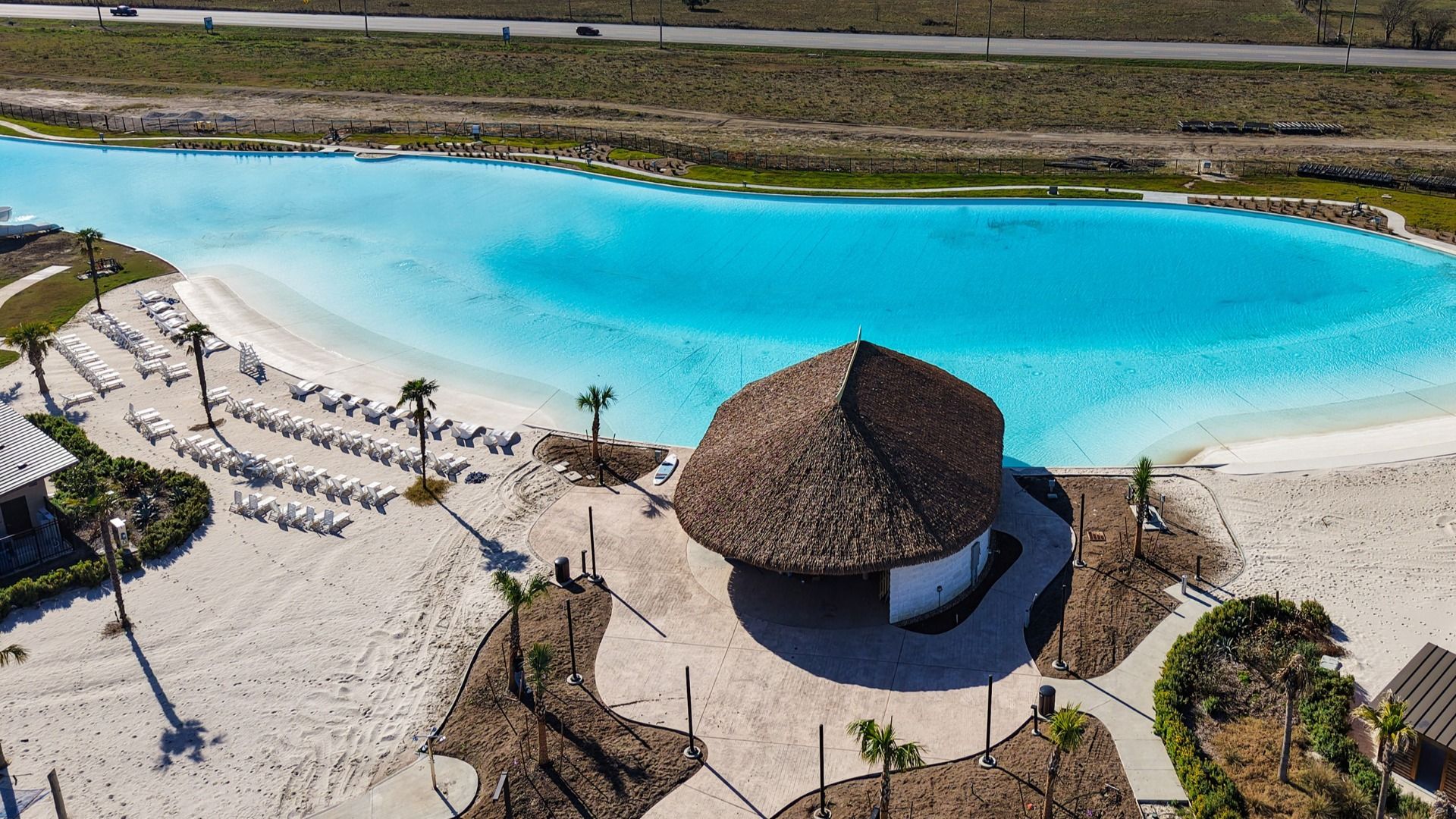 Experience opulent leisure by the pristine turquoise lagoon, complete with elegant loungers in River Ranch.