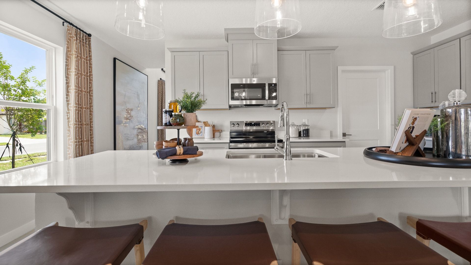 Farmhouse style Kitchen in this New Construction Home in Winter Haven Florida by DRB Homes the Jupiter in Willowbrook North