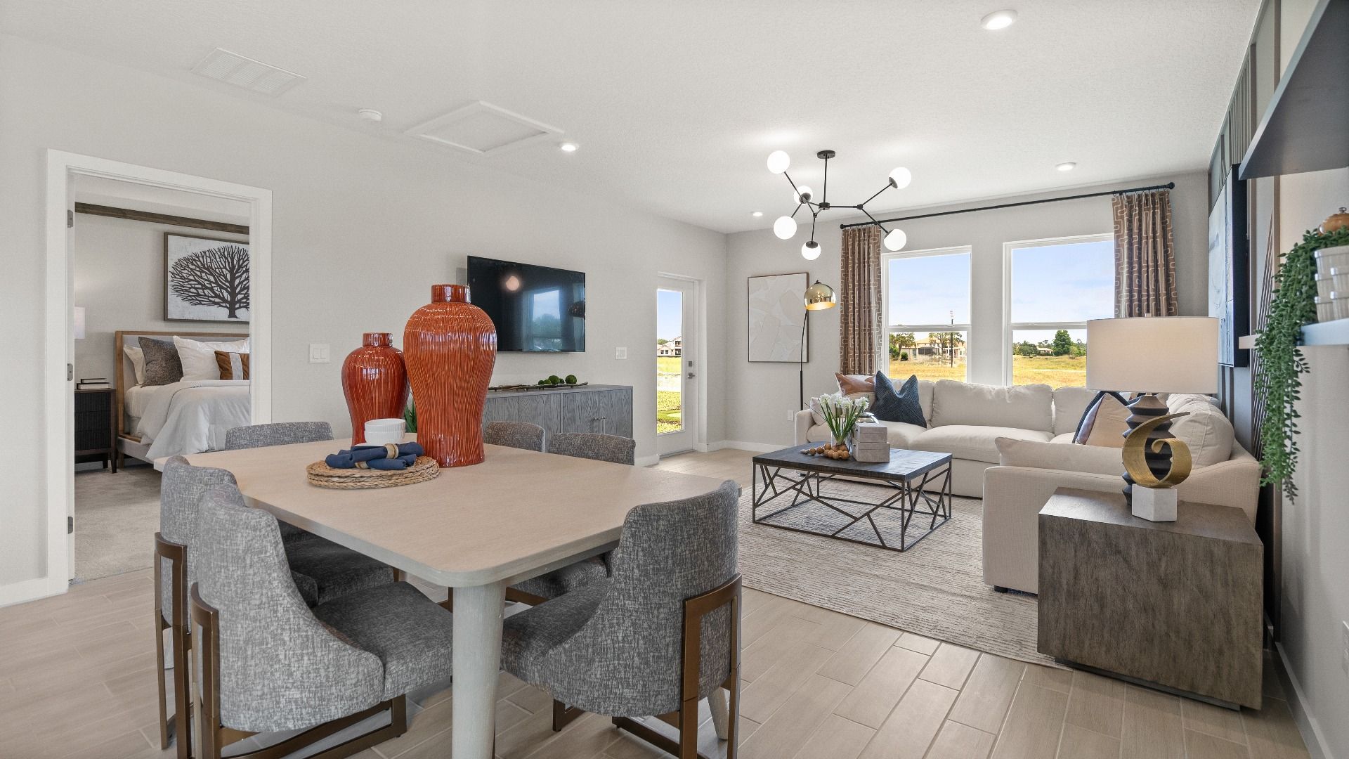Decorated Living Area and Dining Area in this New Construction Home in Winter Haven Florida by DRB Homes in Willowbrook North