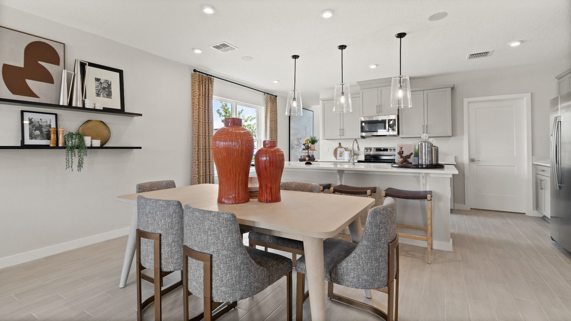 Decorated Living Area and Dining Area in this New Construction Home in Winter Haven Florida by DRB Homes in Willowbrook North
