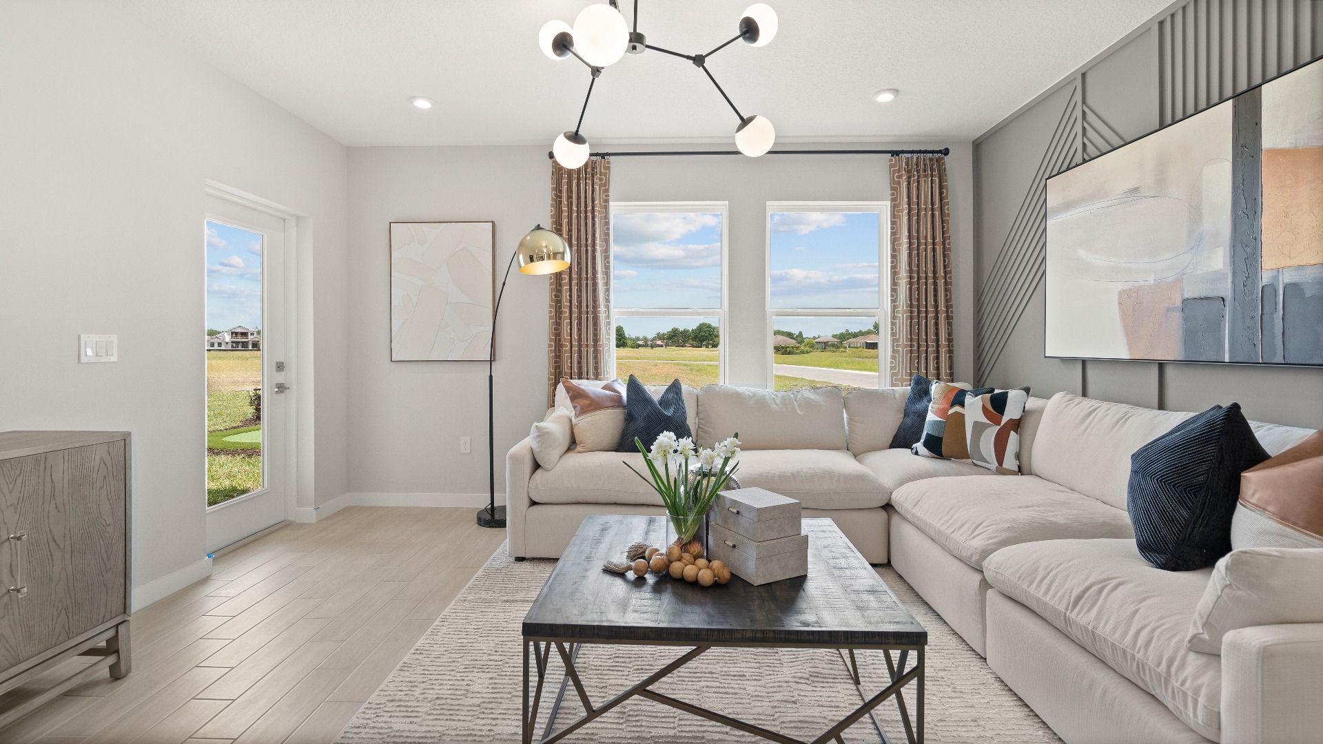 Modern Decorated Living Area with in this New Construction Home in Winter Haven Florida by DRB Homes in Willowbrook North