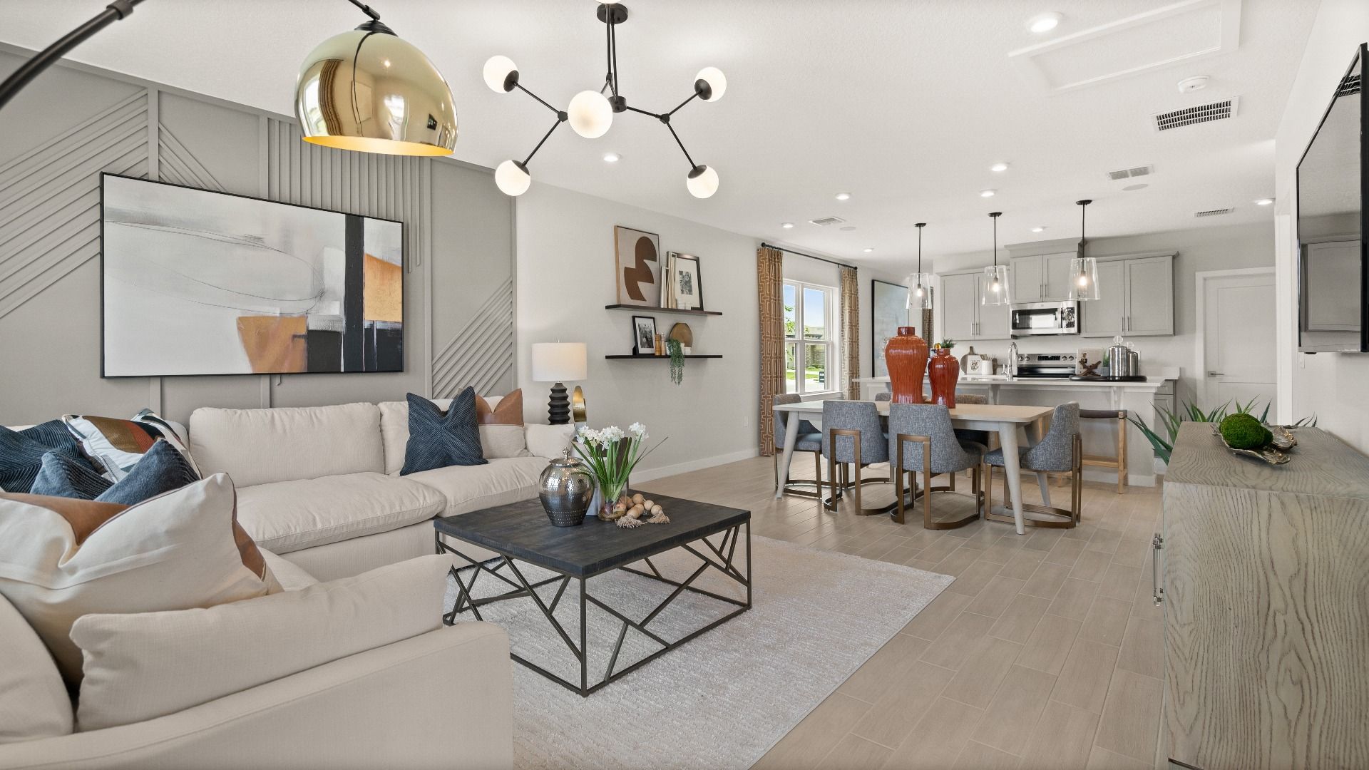 Modern Decorated Living Area with in this New Construction Home in Winter Haven Florida by DRB Homes in Willowbrook North