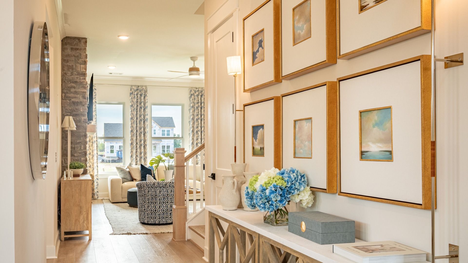 Expertly designed entry leading to great room after passing bedroom and formal living room