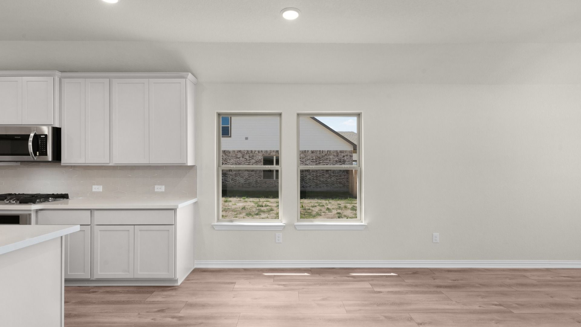 Casual Dining Area open to kitchen featuring windows for natural lighting