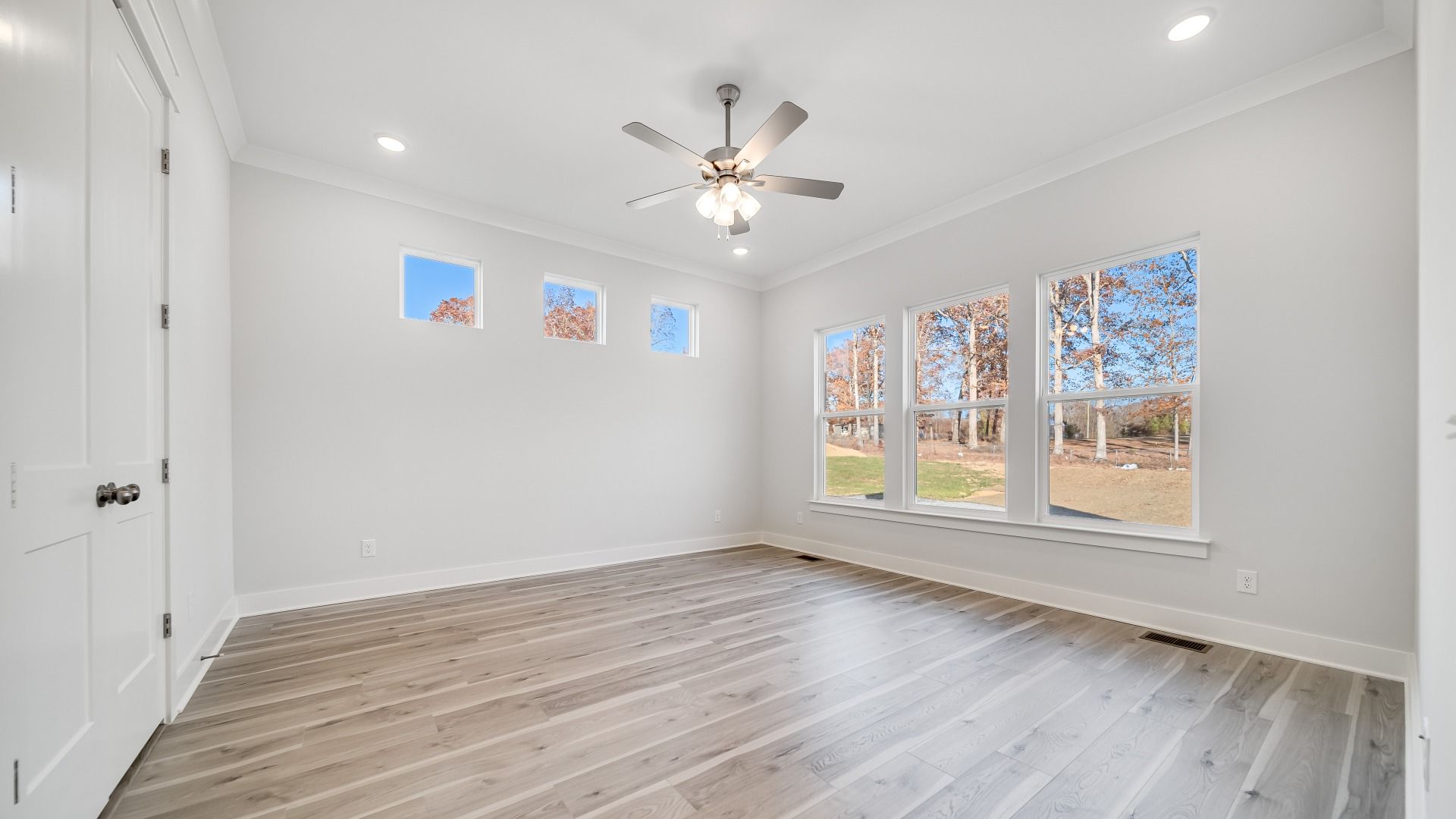 Primary Bedroom with large and porthole windows for maximum natural light