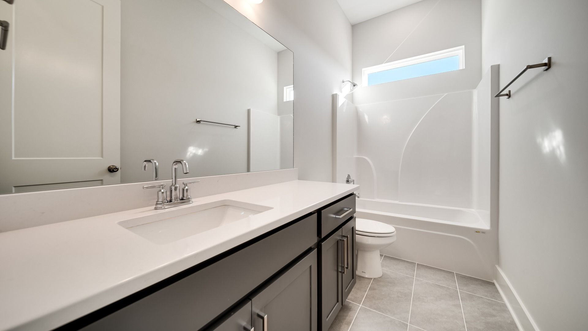 Secondary Bathroom with vanity, shower, toilet