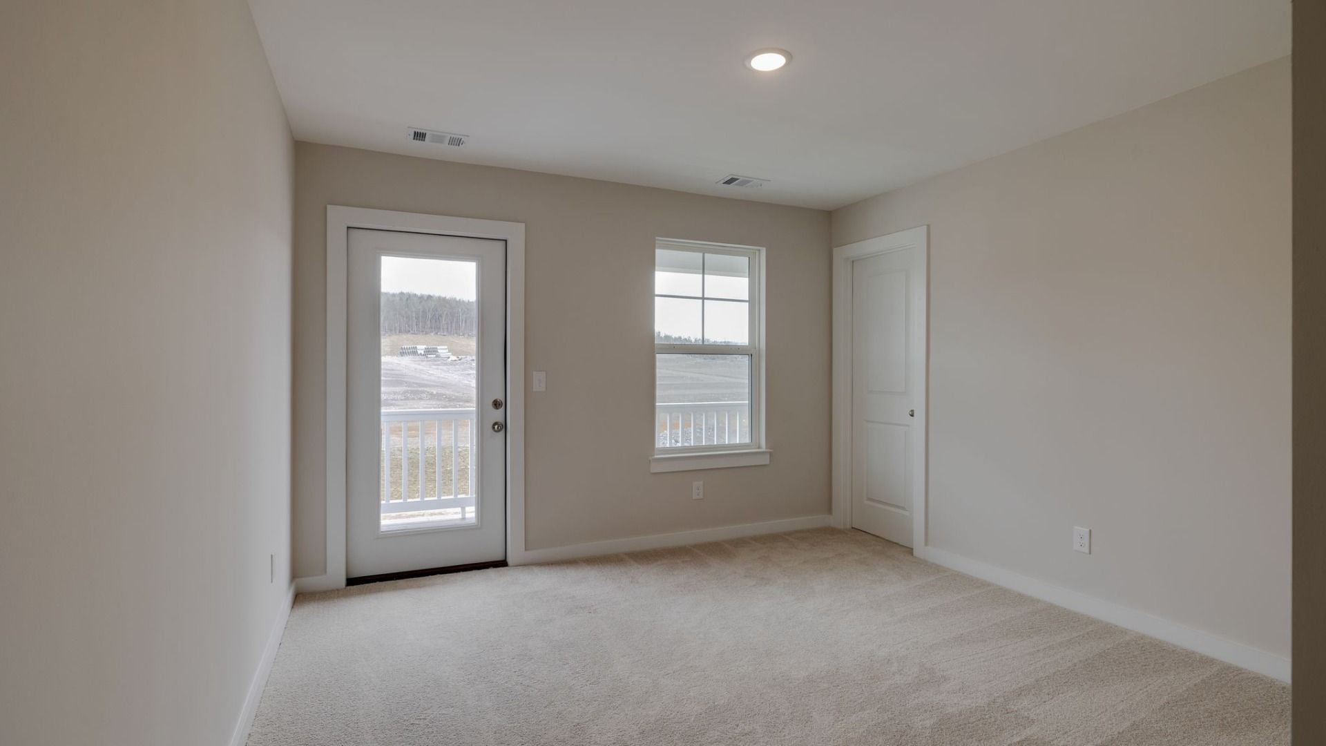 Bedroom with exterior door to access second floor balcony