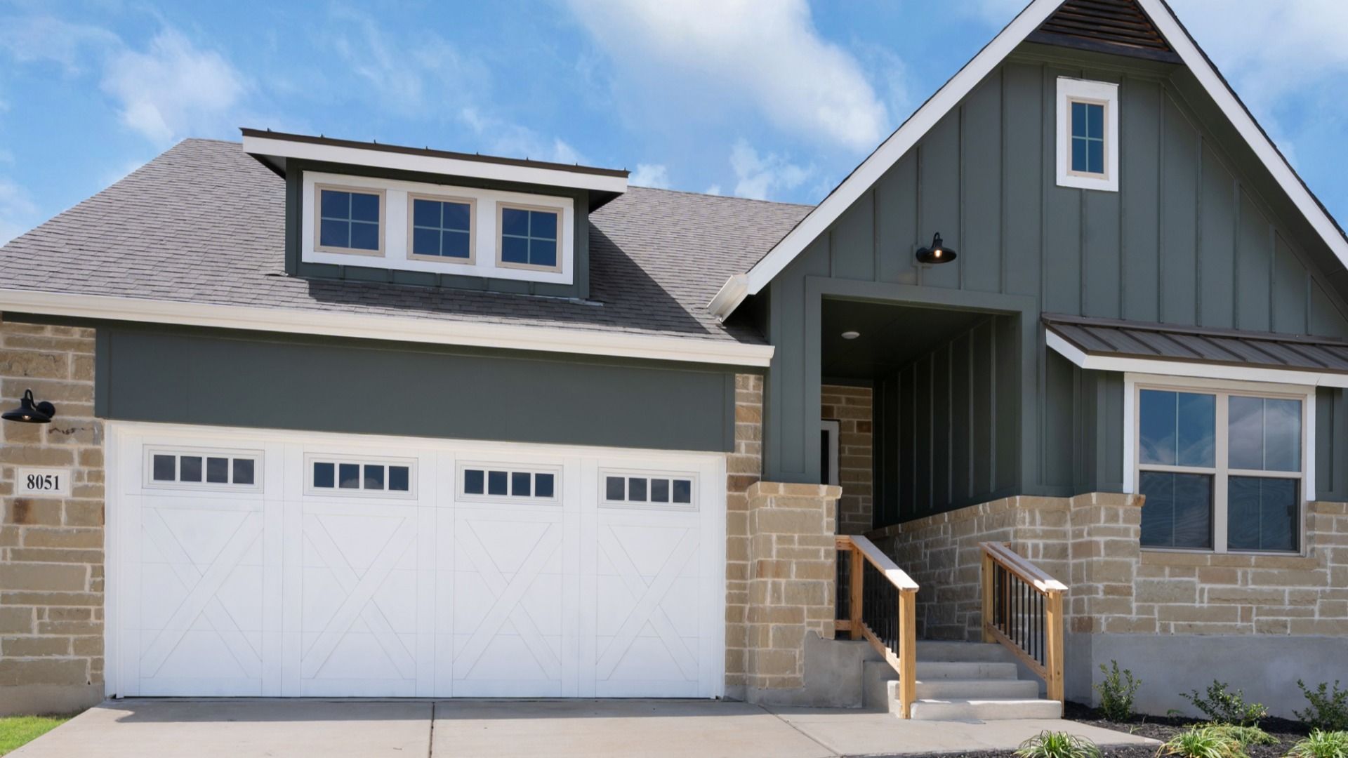 8051 Coral Draw. Beautiful exterior with rock-accented entry and inviting front porch.