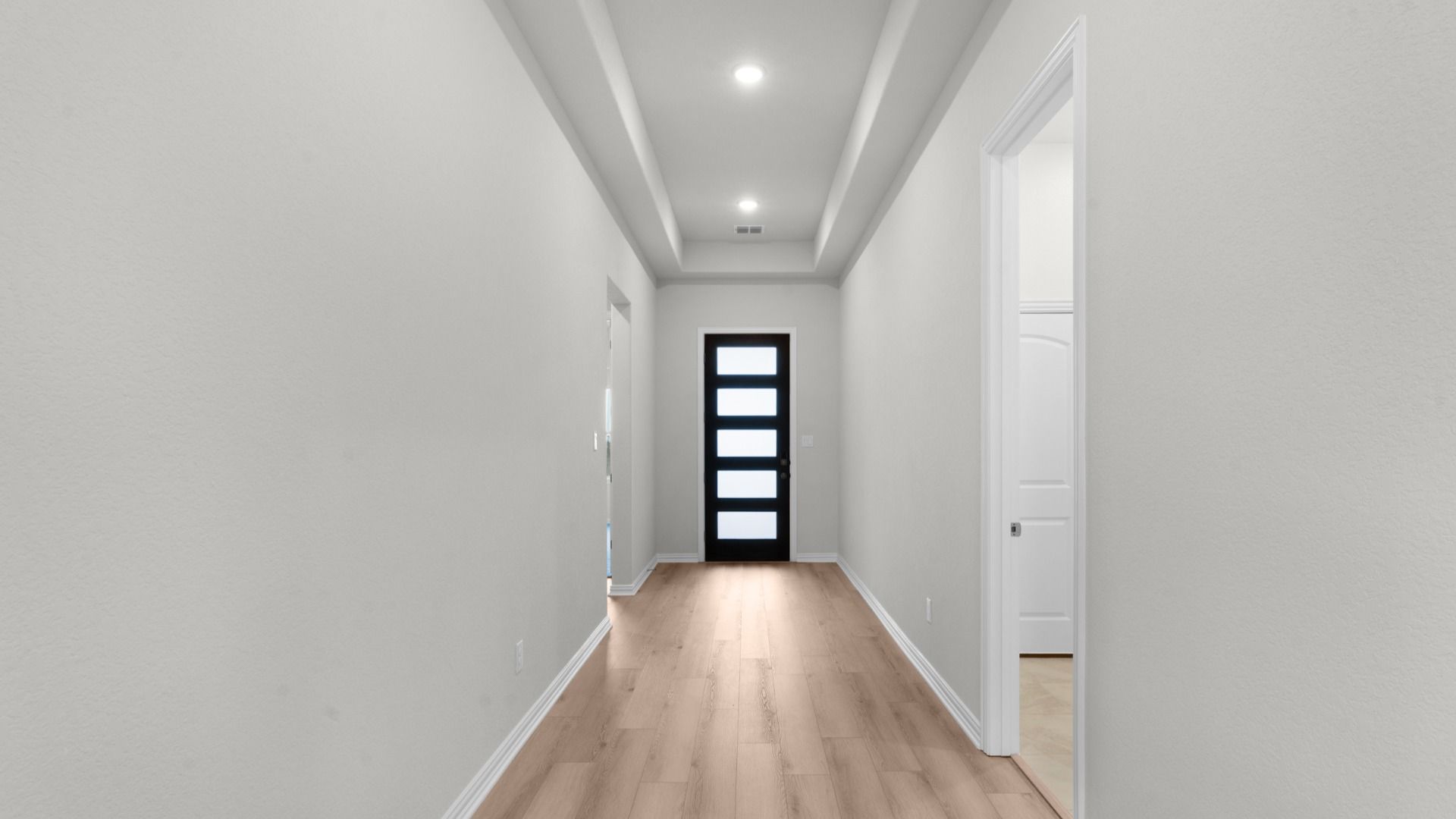 Welcoming foyer with raised ceilings and elegant first impression