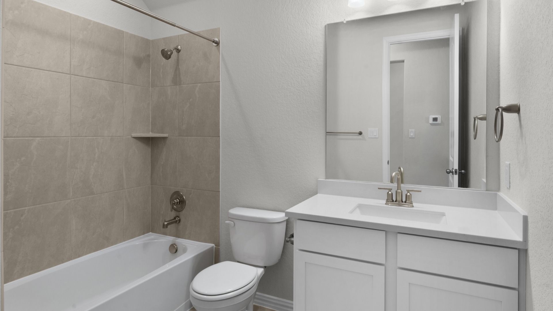 Clean and functional secondary bath with modern finishes