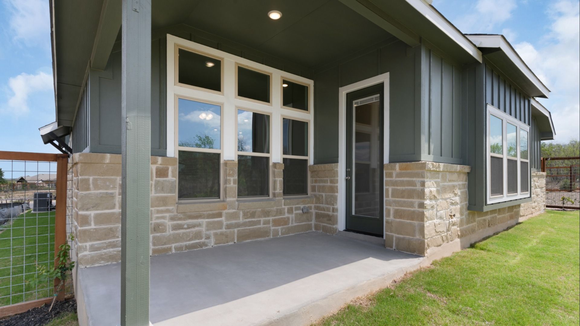 Attractive exterior offering style, comfort, and welcoming covered patio