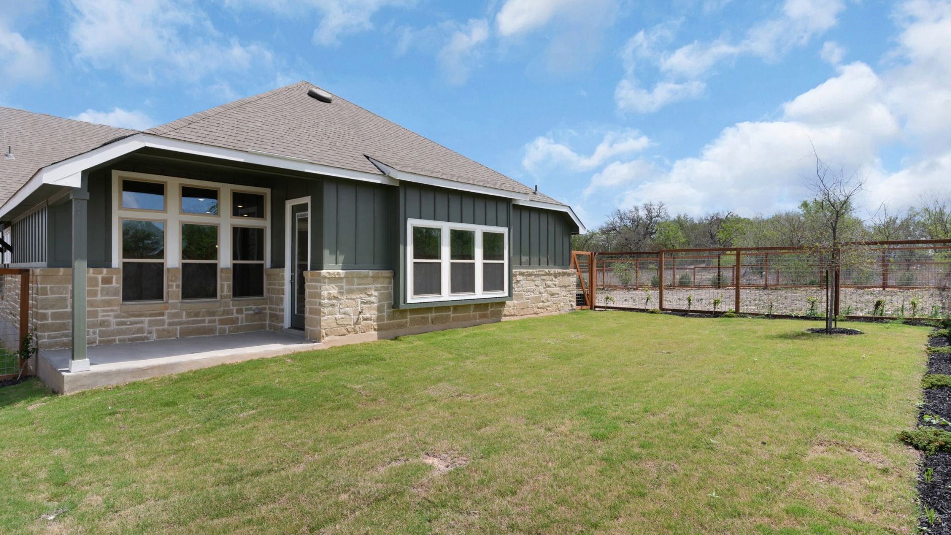 Attractive exterior offering style, comfort, and welcoming covered patio