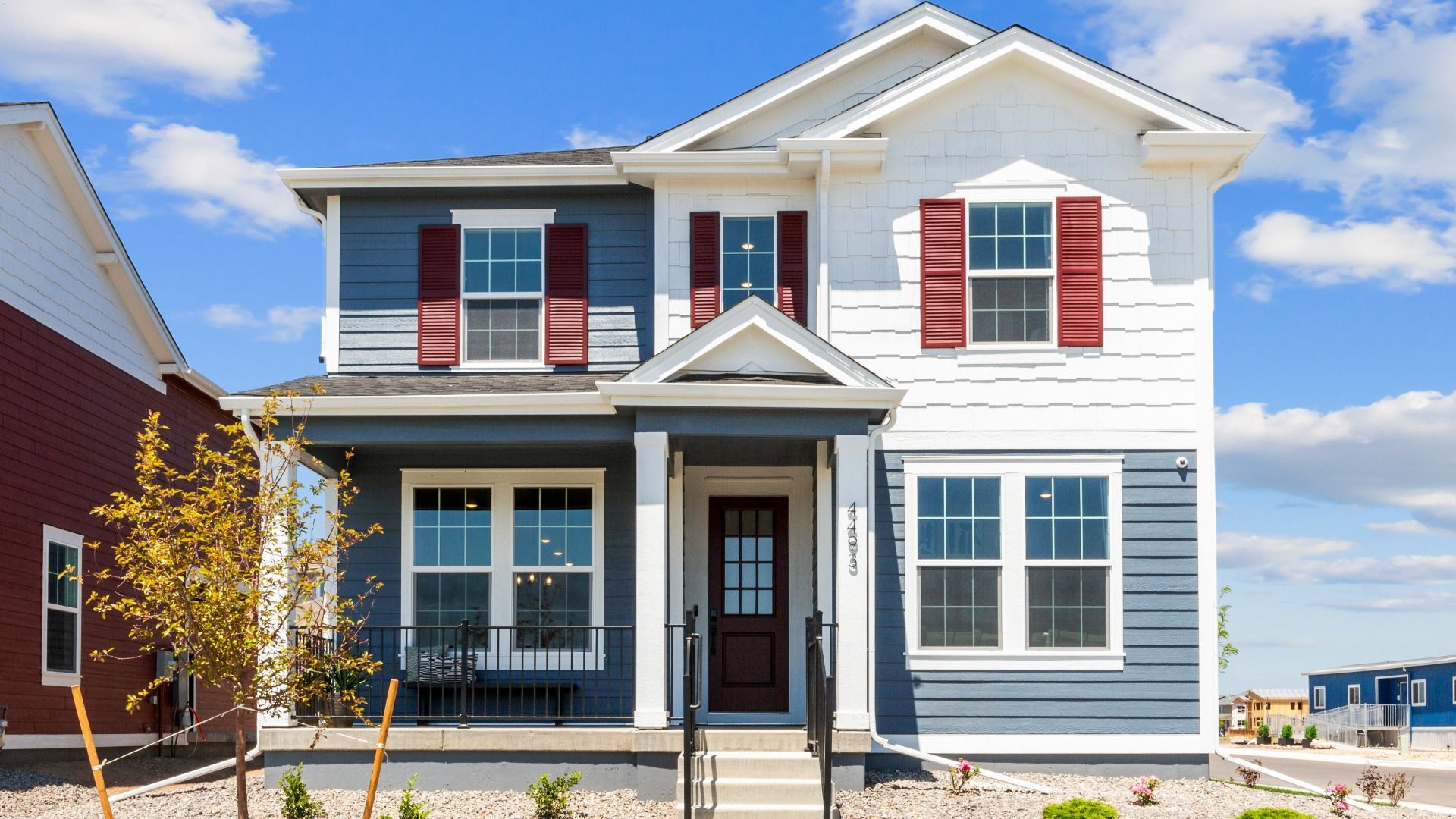 Stunning blue and white exterior with classic pergola entry. Located in the sought-after Timnath Lakes.