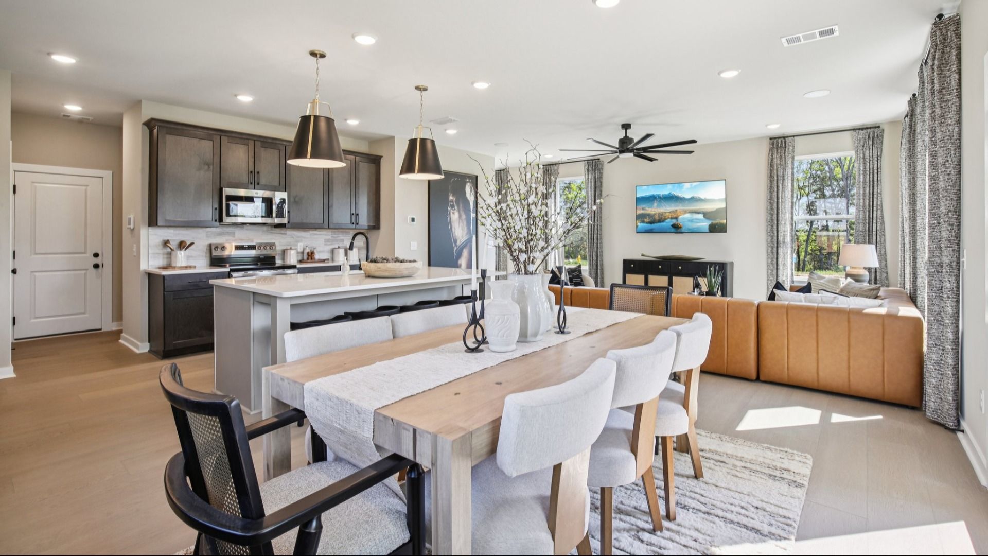 Full view of first floor living room, kitchen, and dining area