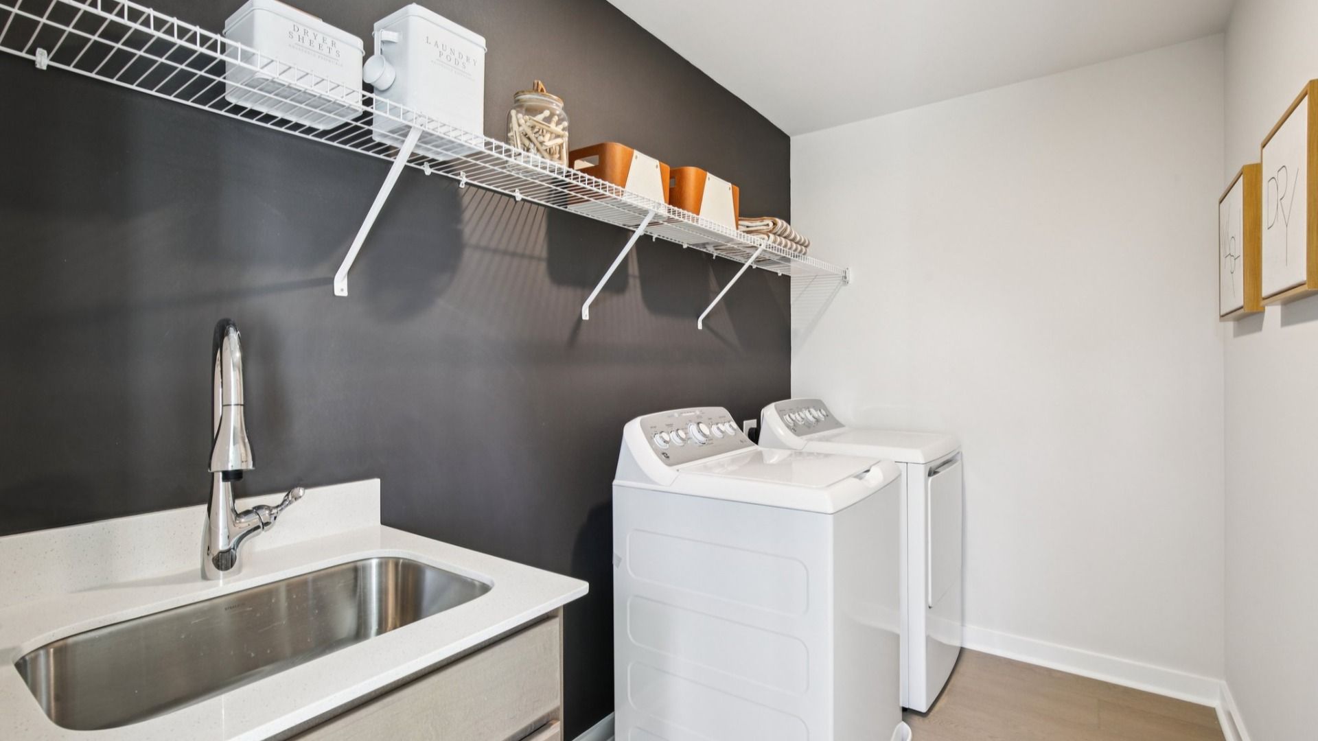 Laundry appliances and included sink for rinsing laundry