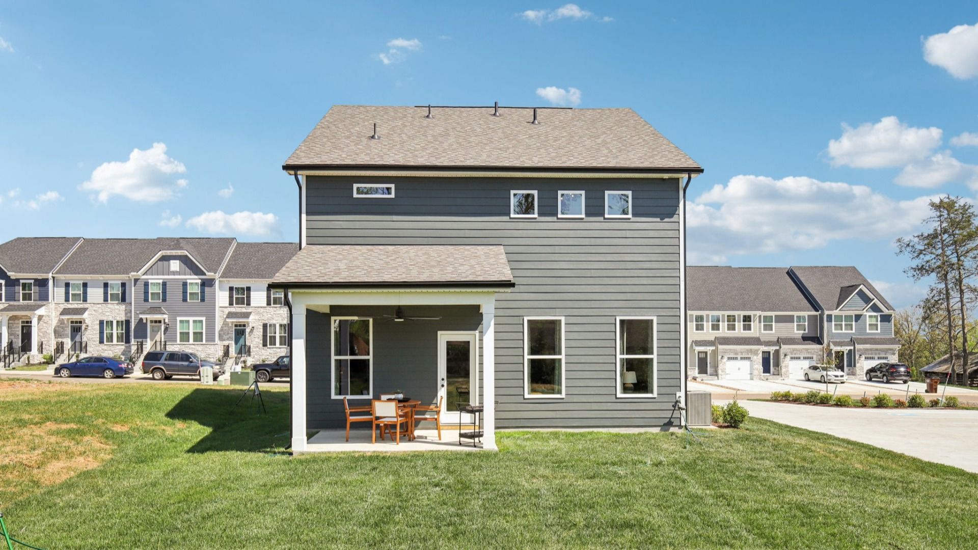 View of home from backyard showing covered back patio