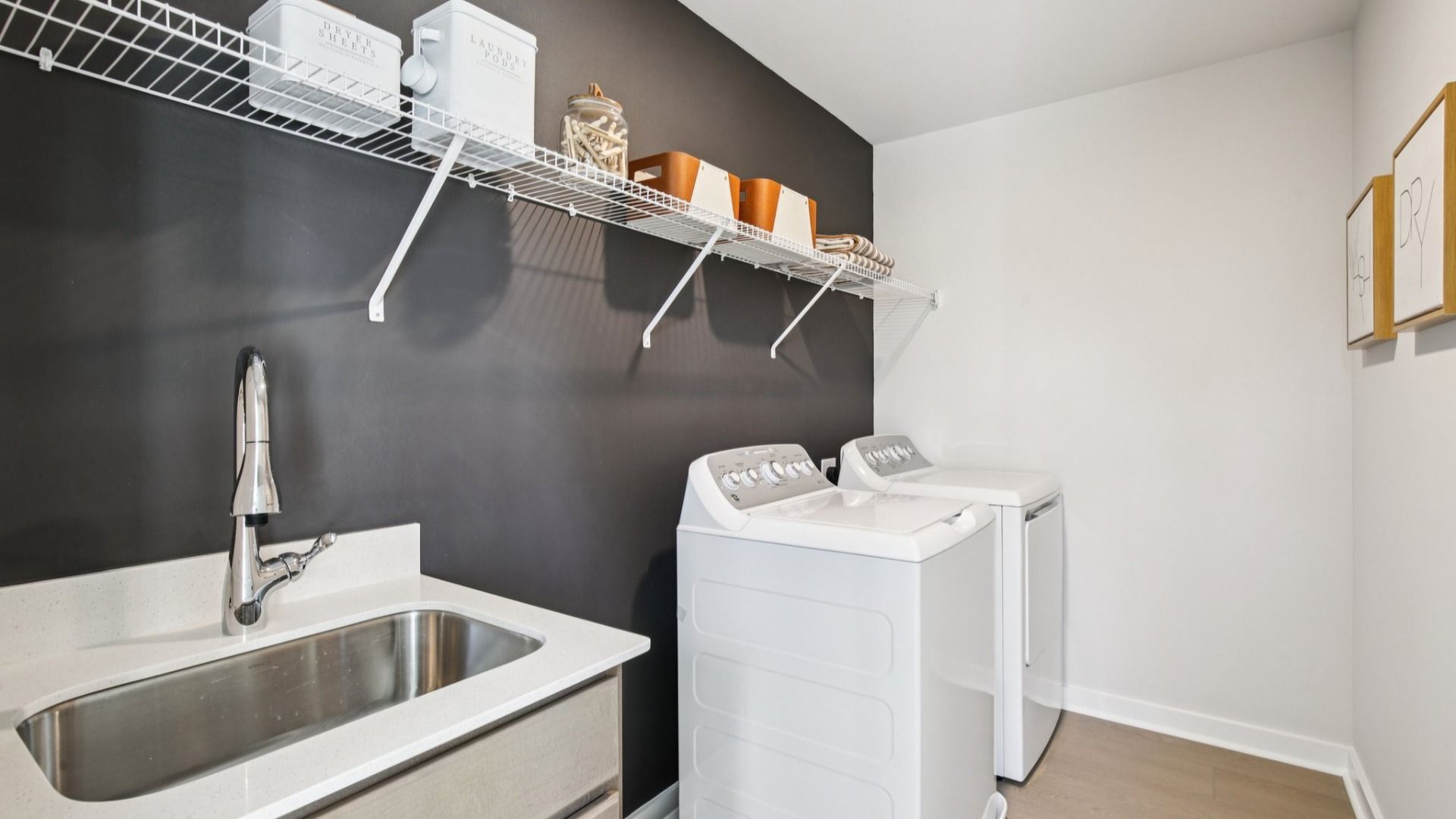 Laundry appliances and included sink for rinsing laundry to make chores a breeze