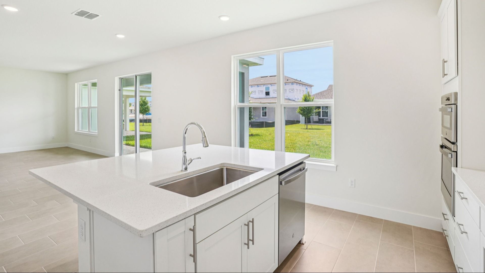 Plumeria Floor Plan featuring a bright kitchen with large island by DRB Homes in Trailside located in Mount Dora, FL