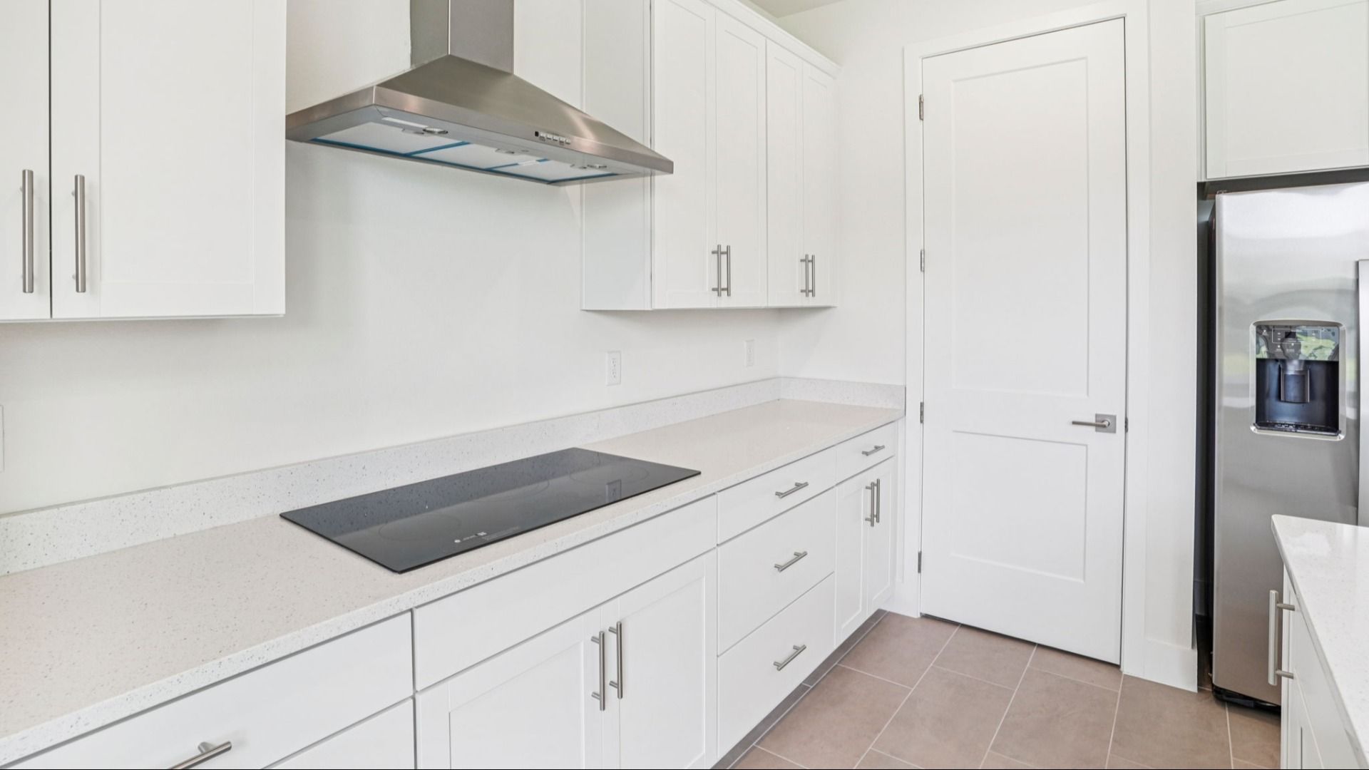Plumeria Floor Plan featuring a bright kitchen glass stove top by DRB Homes in Trailside located in Mount Dora, FL