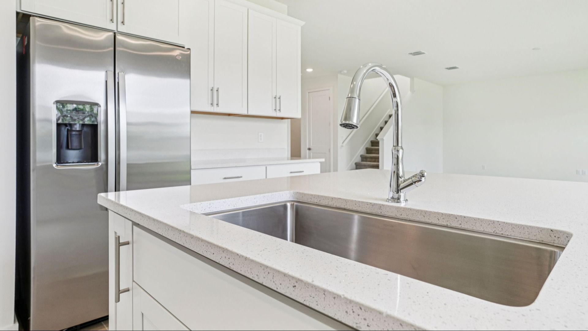 Plumeria Floor Plan featuring a bright kitchen with large island by DRB Homes in Trailside located in Mount Dora, FL